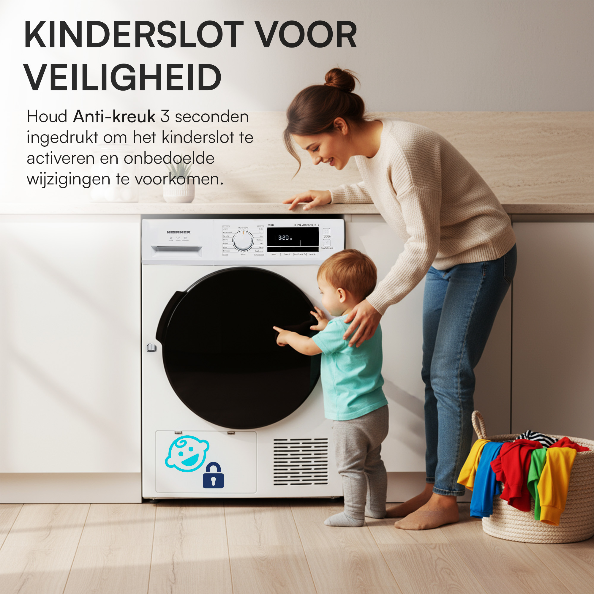 A woman and a toddler stand near a dryer. The child points at the dryer. A basket of clothes is on the right.