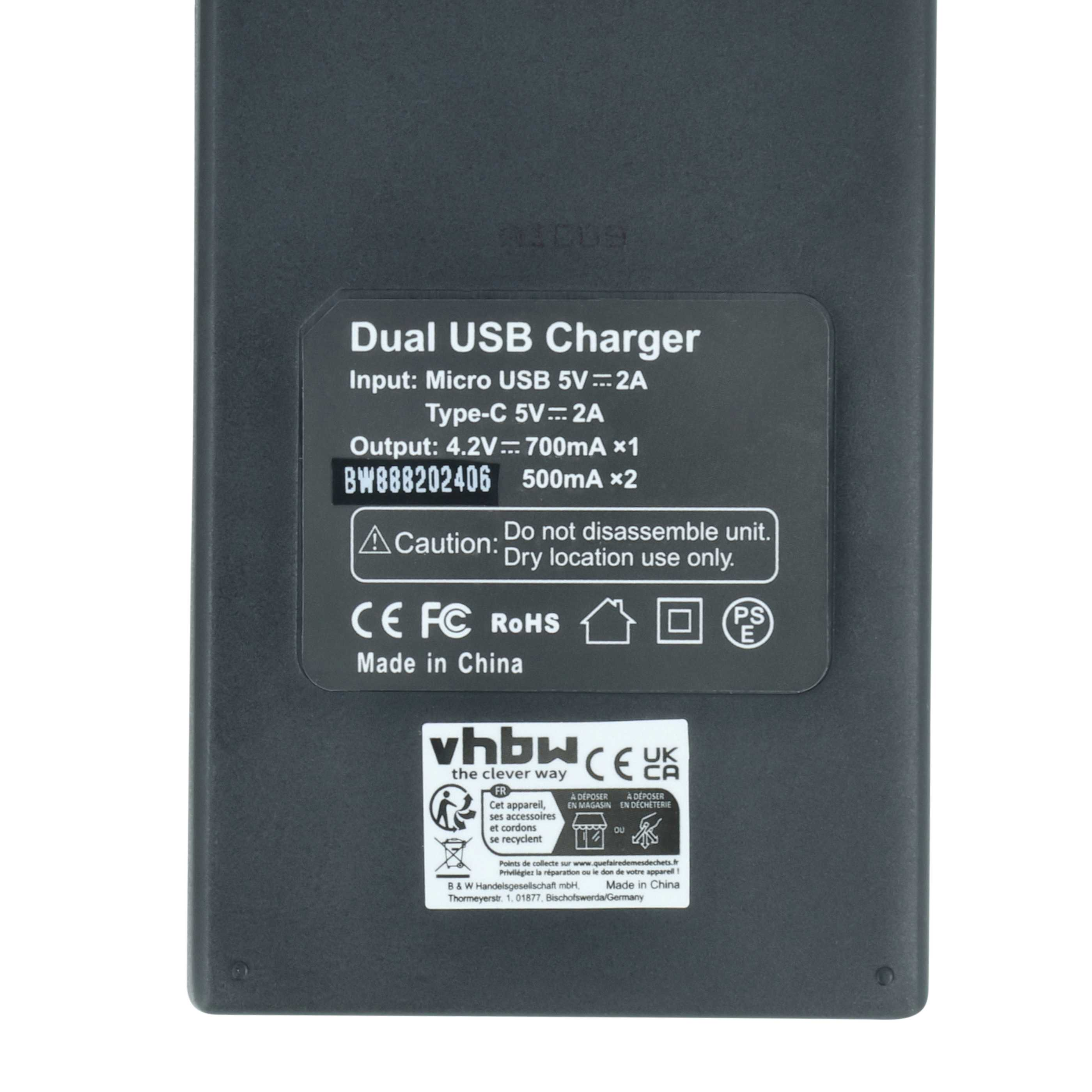 Ein schwarzes Dual-USB-Ladegerät mit Text. Details umfassen Eingangs-, Ausgangs- und Warnhinweise.