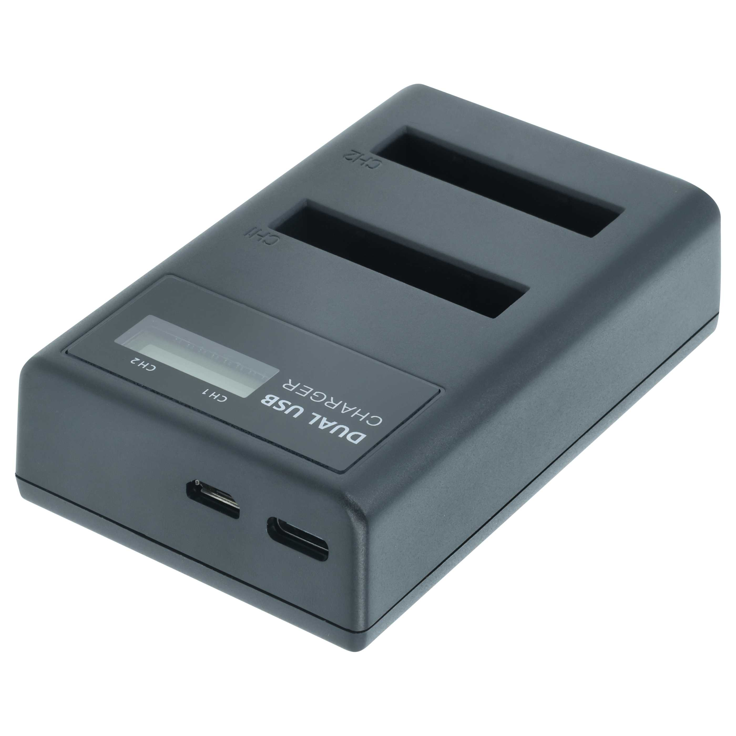 Ein dunkelgraues Dual-USB-Ladegerät mit zwei Ladeschlitzen. Es hat ein kleines Display und USB-Anschlüsse.
