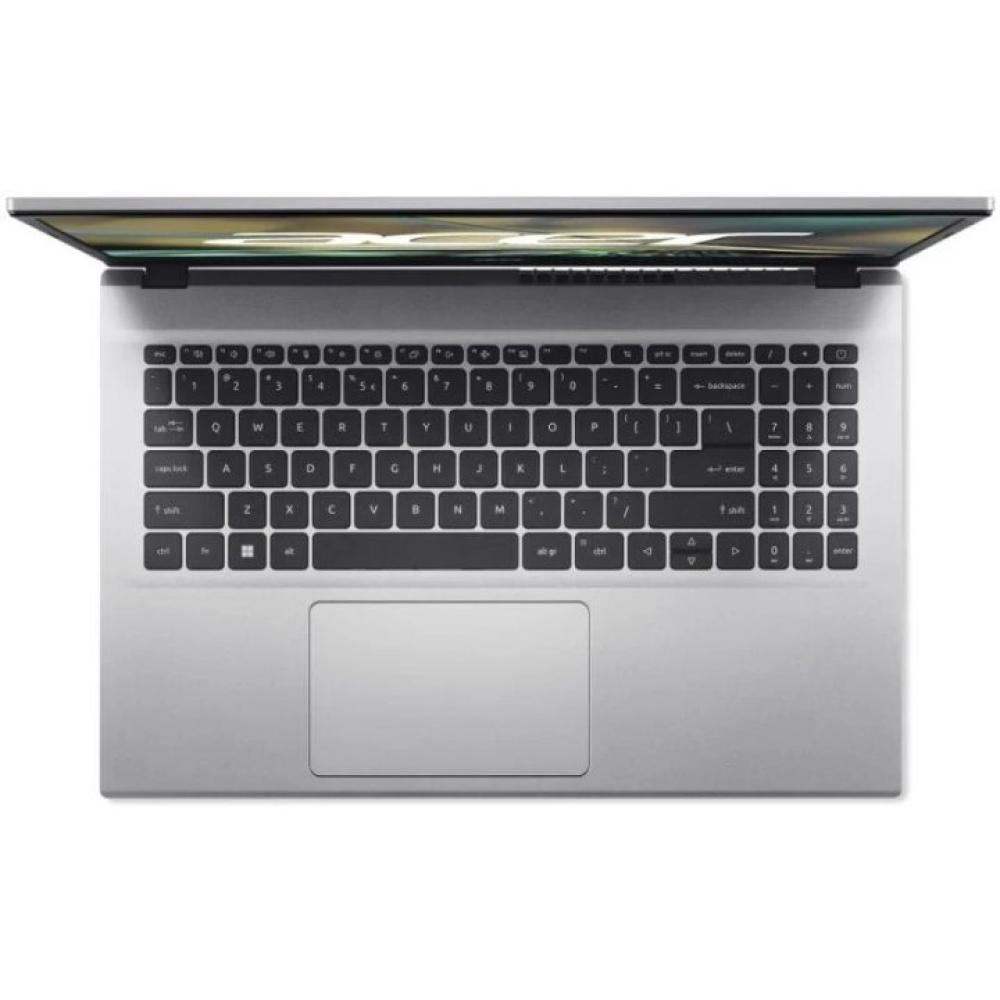 Vista superior de un portátil plateado abierto. El teclado está enfocado con las teclas visibles. El panel táctil está debajo del teclado.