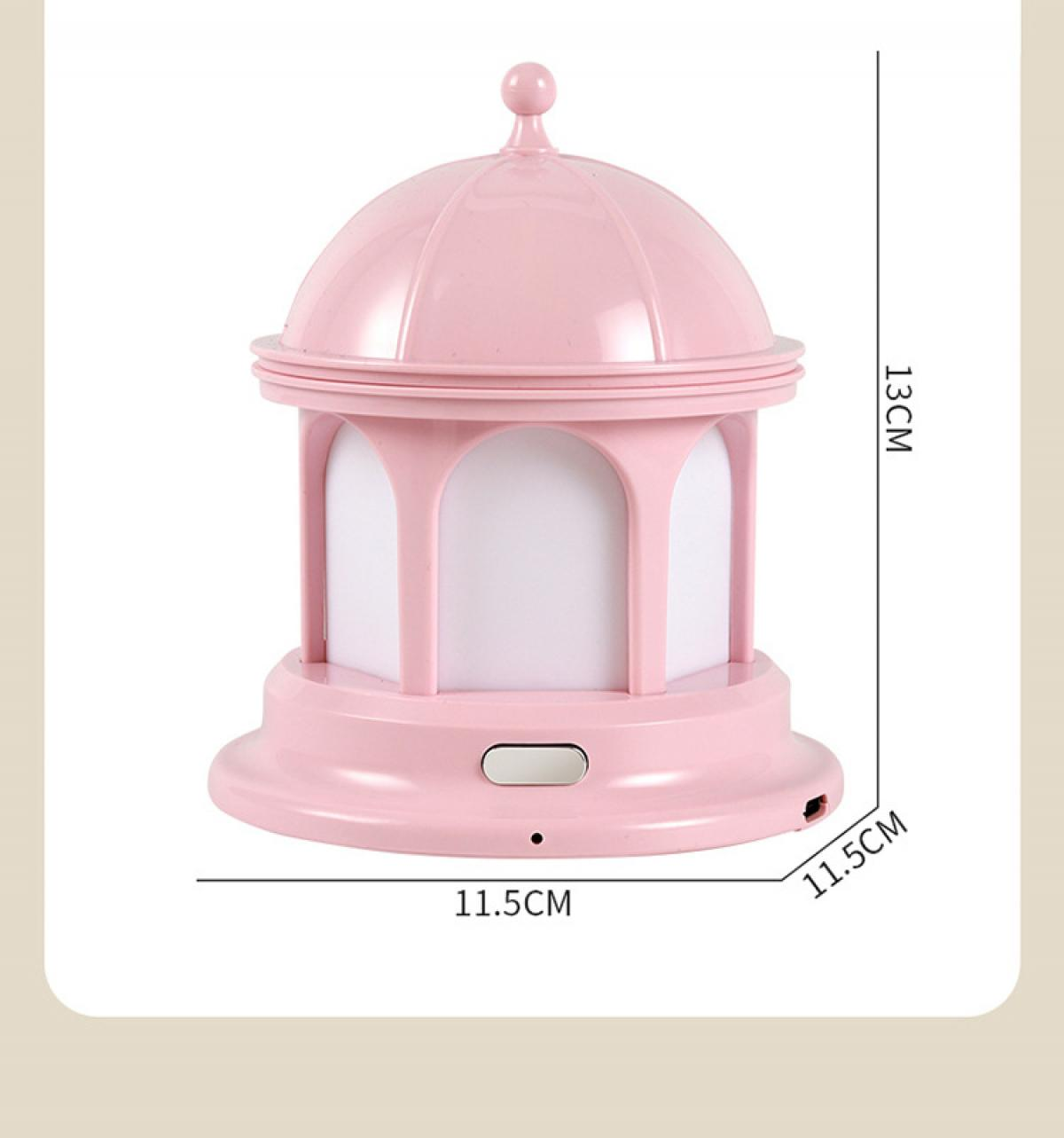 Ein rosa, kuppelförmiges Nachtlicht. Es hat einen Sockel, einen zylindrischen Mittelteil mit Bögen und eine abgerundete Oberseite.