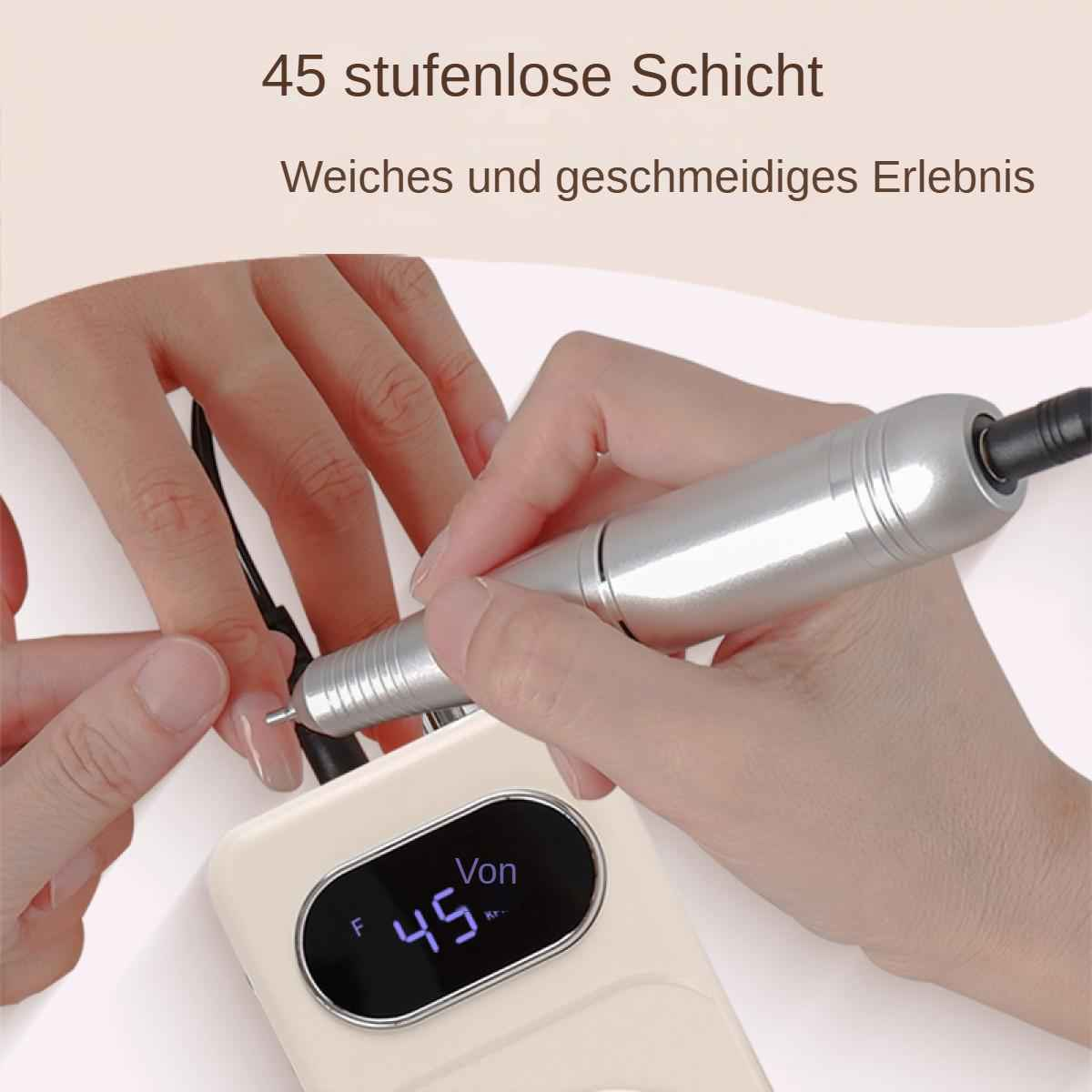 Eine Person verwendet einen Nagelbohrer an einem Fingernagel. Das Gerät ist silberfarben und mit einer weißen Basis mit Display verbunden.