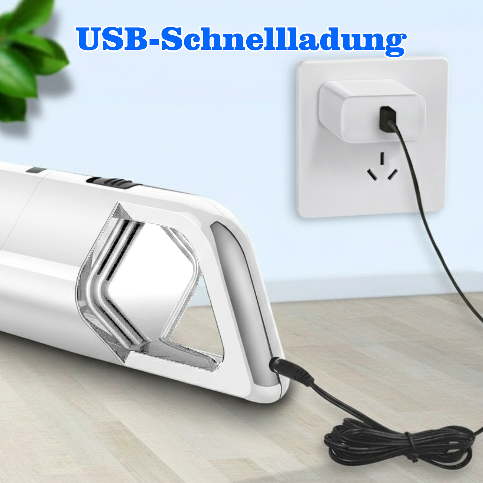 Ein weißer Handstaubsauger ist an eine Steckdose angeschlossen. Der Text USB-Schnellladung steht über dem Staubsauger.