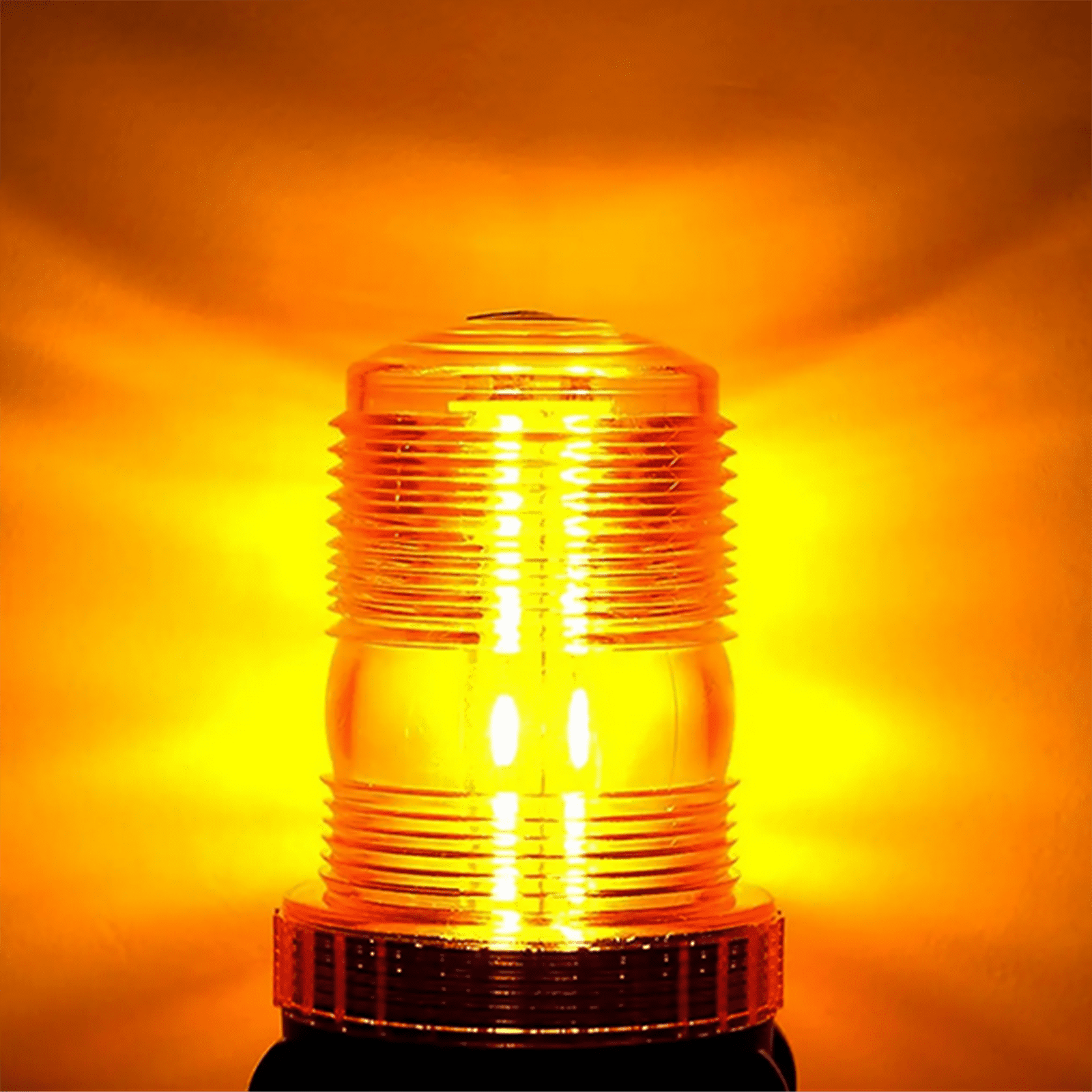 Ein orangefarbenes Warnlicht. Es hat eine zylindrische, gerippte Linse. Der Hintergrund ist ein Gradient aus Orange und Gelb.