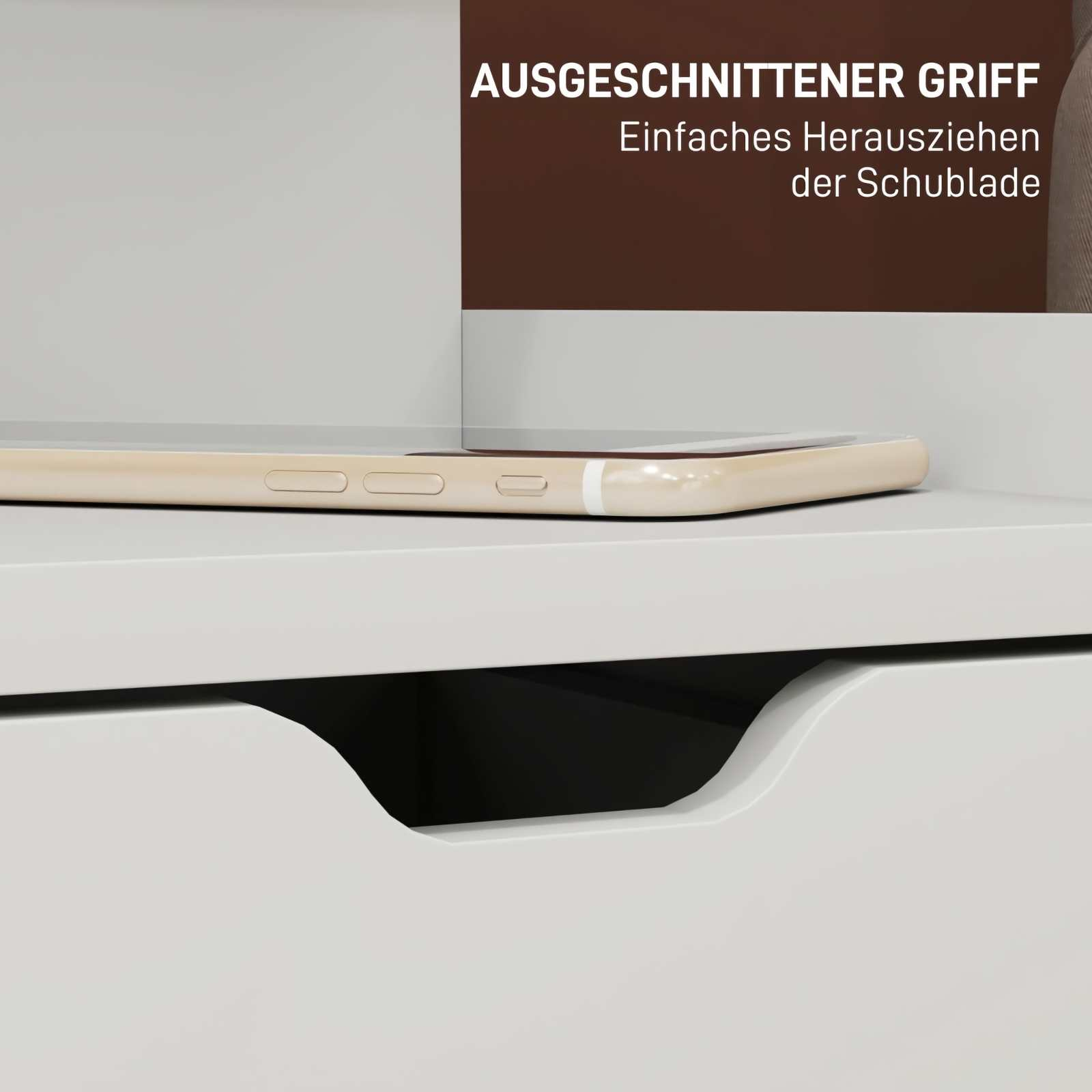 Nahaufnahme einer weißen Schublade mit eingelassenem Griff. Ein Telefon liegt oben. Text auf Deutsch ist sichtbar.