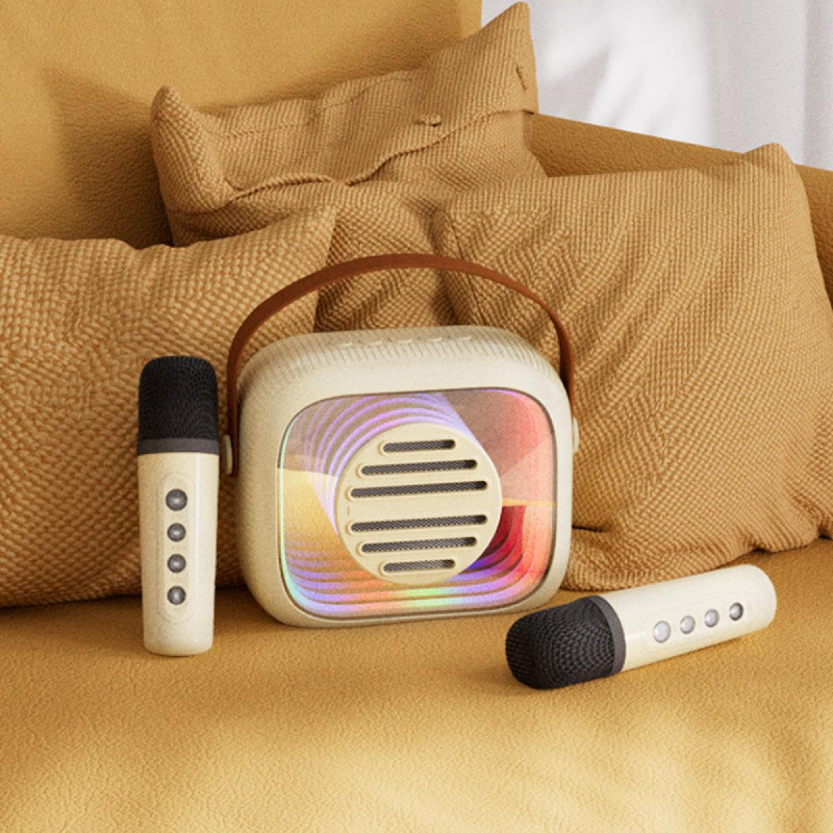 Ein cremefarbenes Retro-Radio mit zwei Mikrofonen auf einer gelben Couch mit Kissen. Das Radio hat einen Griff und bunte Lichter.