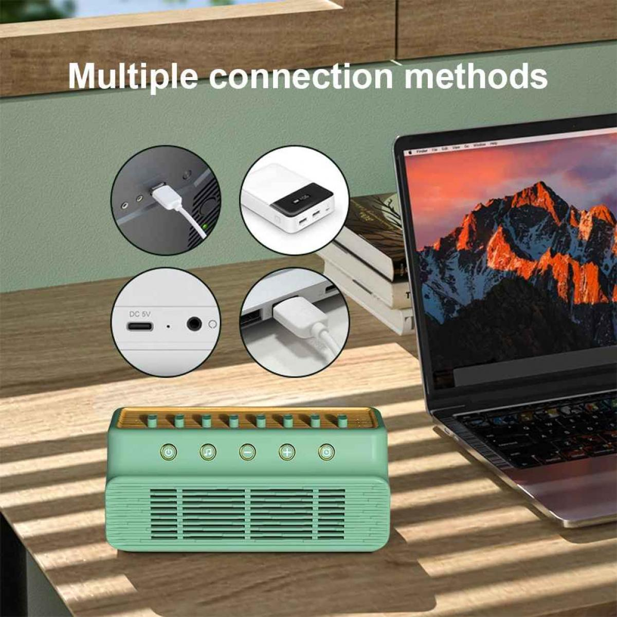 Ein mintgrüner Lautsprecher mit Anschlussmöglichkeiten: USB, DC 5V, Powerbank. Ein Laptop zeigt eine Berglandschaft. Weiße Kabel sind eingesteckt.