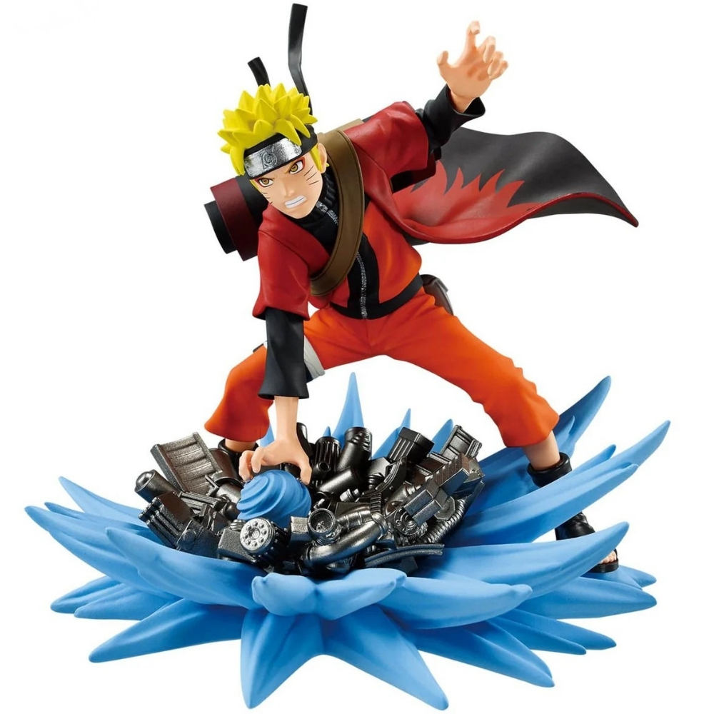 Figura anime di un personaggio in tuta arancione, cappotto rosso, capelli gialli e fascia, in piedi su una base di energia blu, in posa.