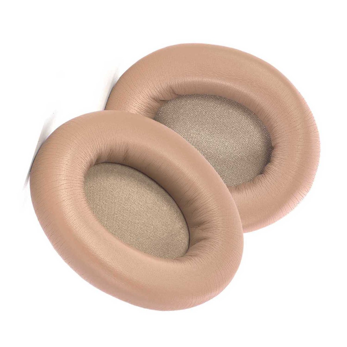 Dos almohadillas beige para auriculares sobre fondo blanco. Cada almohadilla tiene exterior similar al cuero e interior de tela.
