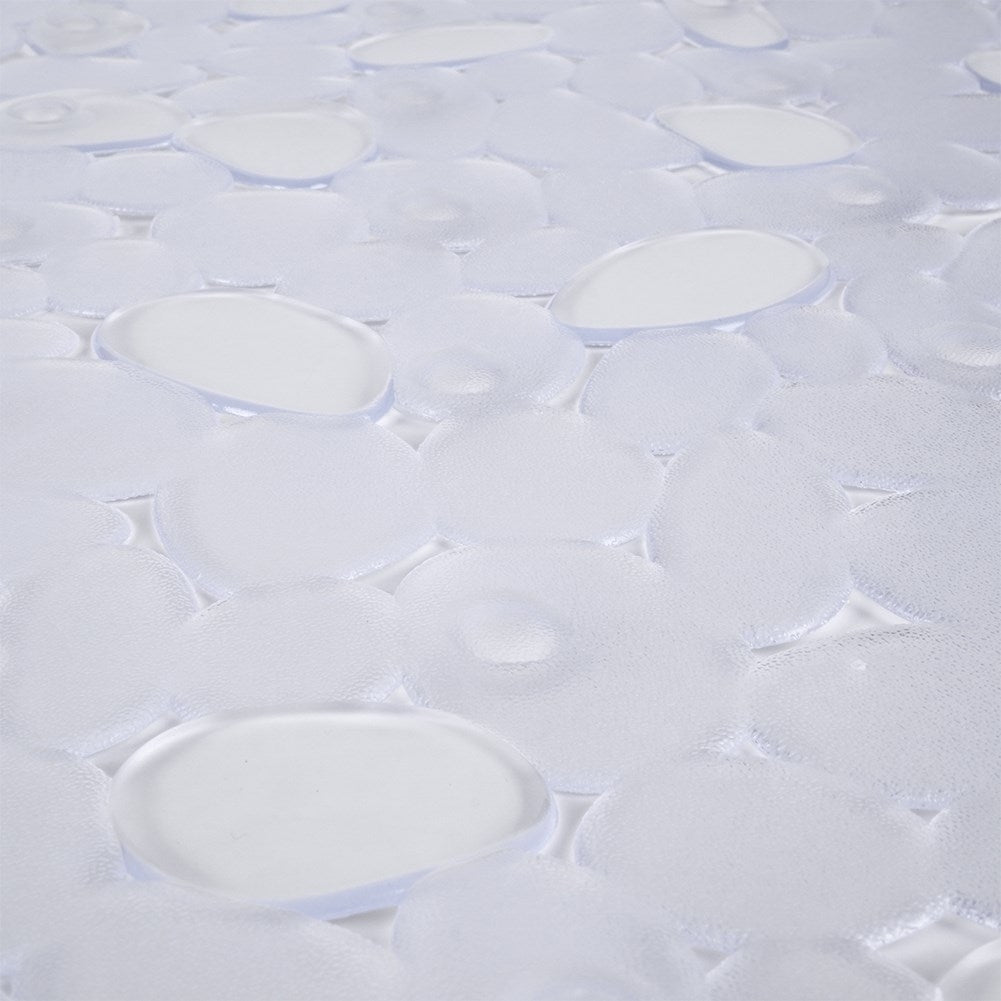 Primer plano de una alfombrilla de baño blanca y texturizada con ventosas transparentes en forma ovalada.