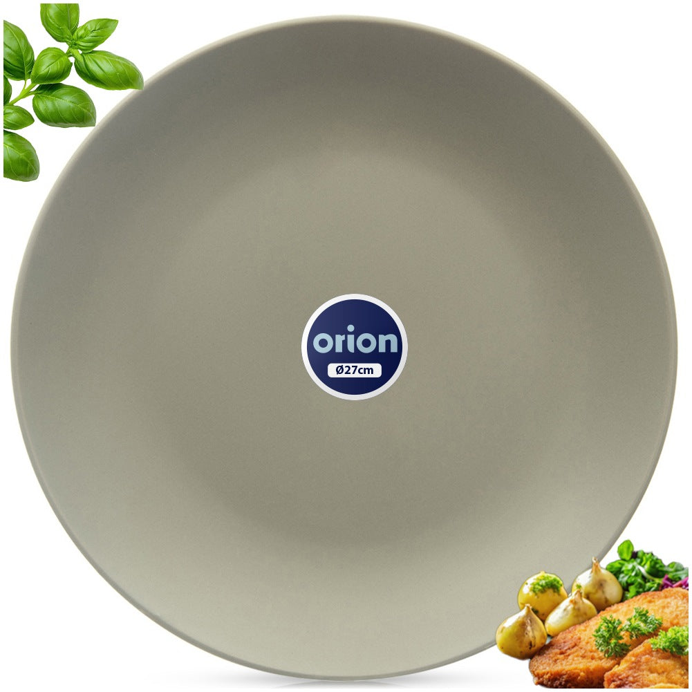 Un plato gris con el logo 'orion', rodeado de hojas de albahaca, comida frita y ajo.