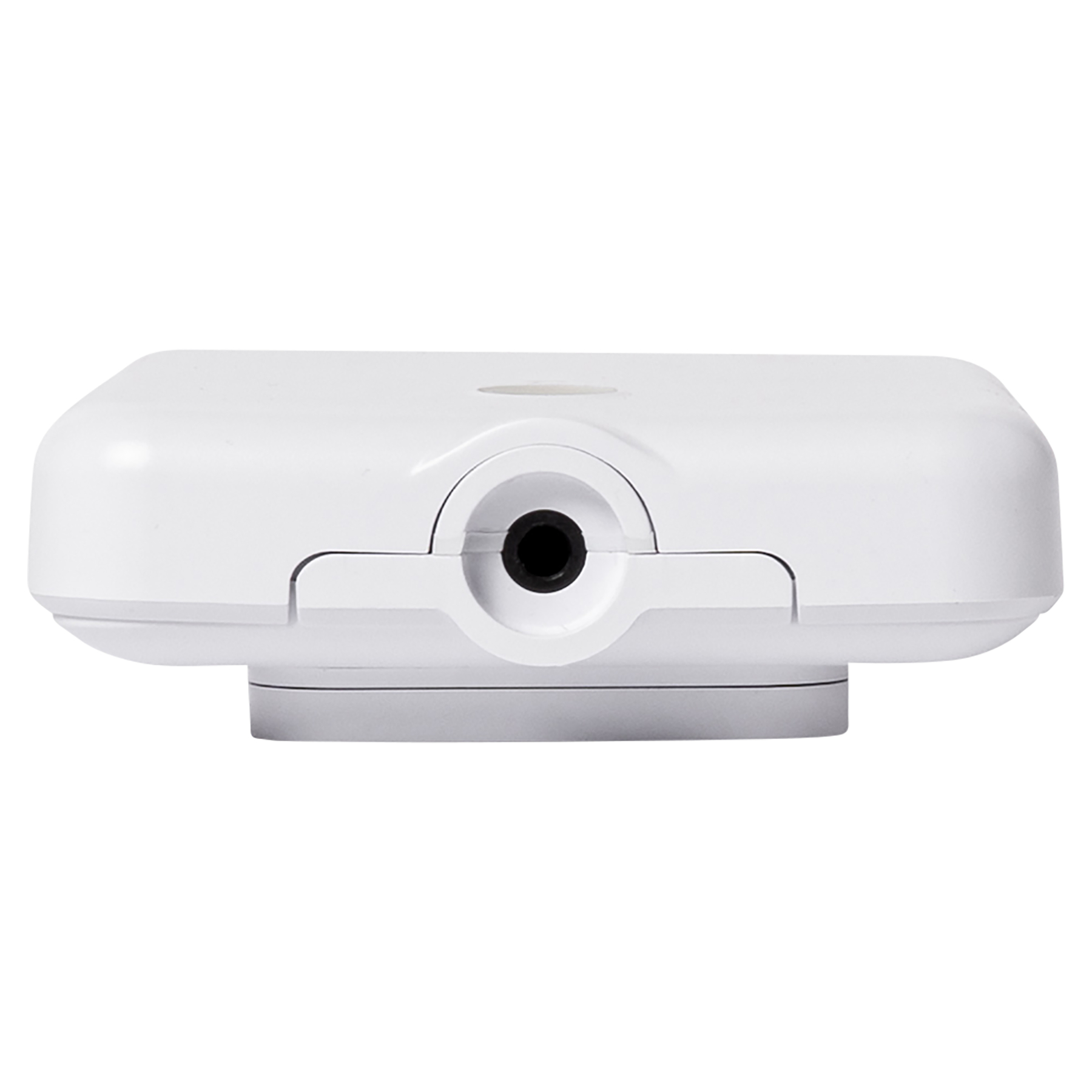 Białe urządzenie z czarnym kółkiem pośrodku. Urządzenie ma zaokrąglony kształt i stoi na szarej podstawie.