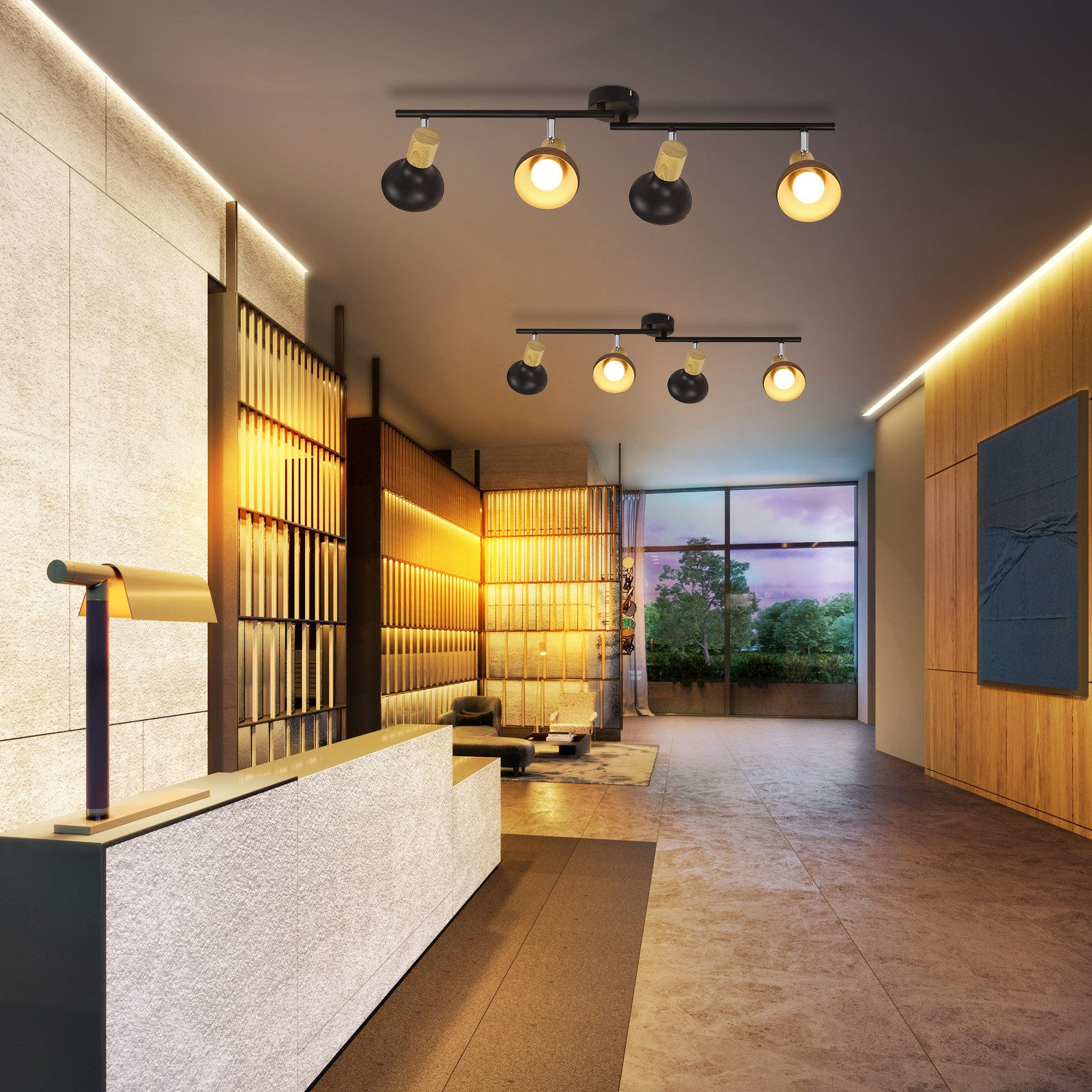 Un interno di una hall moderna con faretti, un banco reception e grandi finestre.