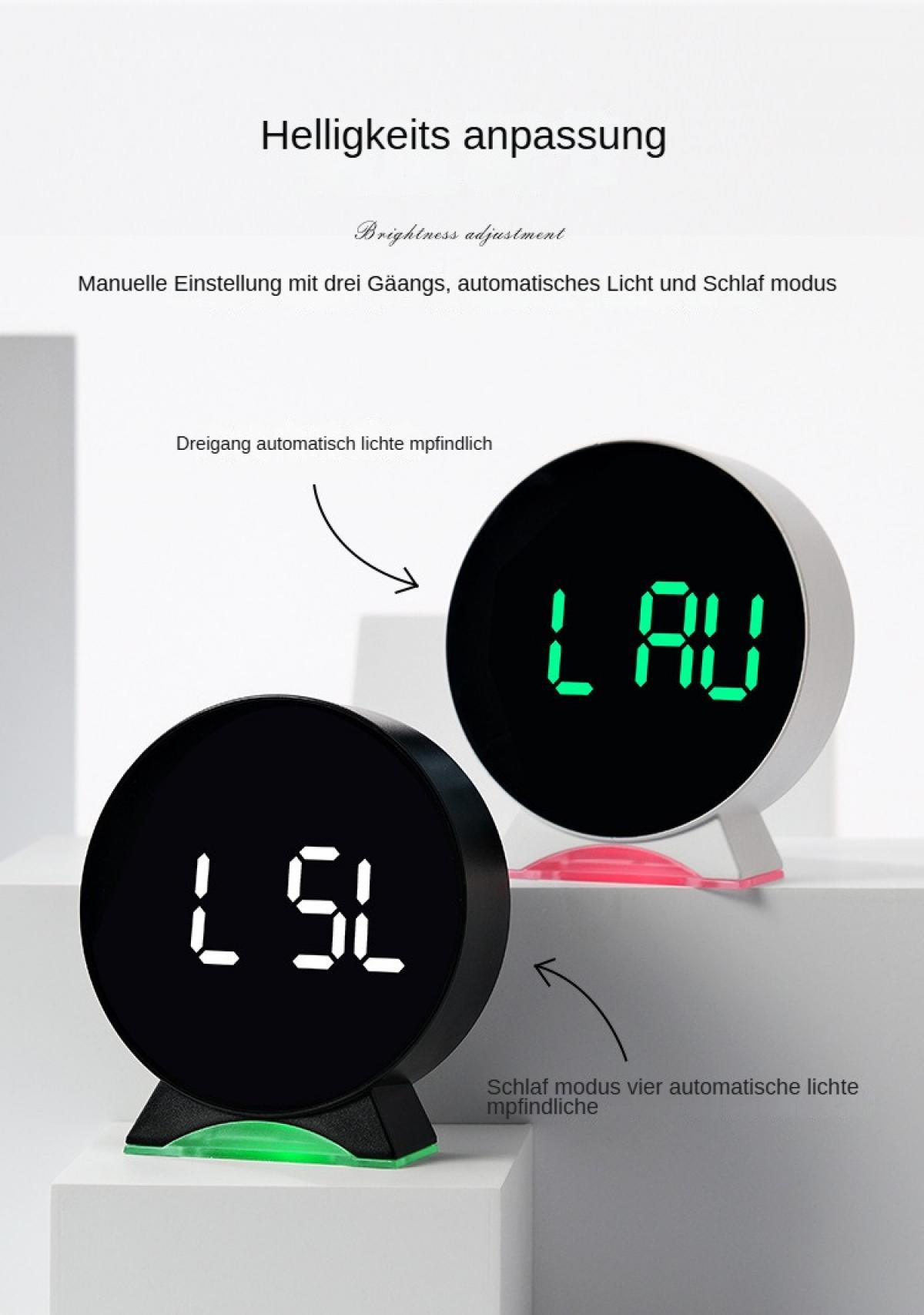 Zwei Digitaluhren mit der Anzeige 'LSL' und 'LAU'. Die Uhren sind schwarz und weiß, mit grünen und roten Lichtern. Text in Deutsch.