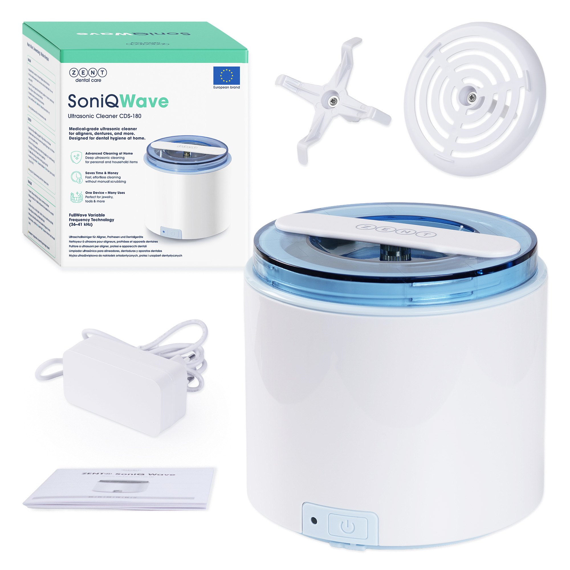 Zdjęcie przedstawia białą myjkę ultradźwiękową z akcesoriami. Widać również pudełko, zasilacz i instrukcję.