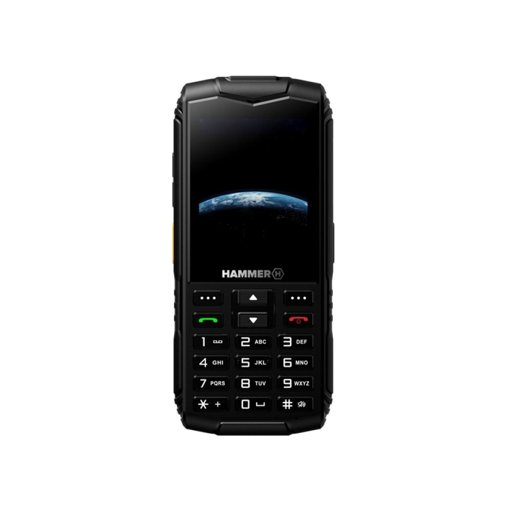 Teléfono Hammer negro. Tiene un teclado con números y teclas de función. La pantalla muestra la Tierra desde el espacio.