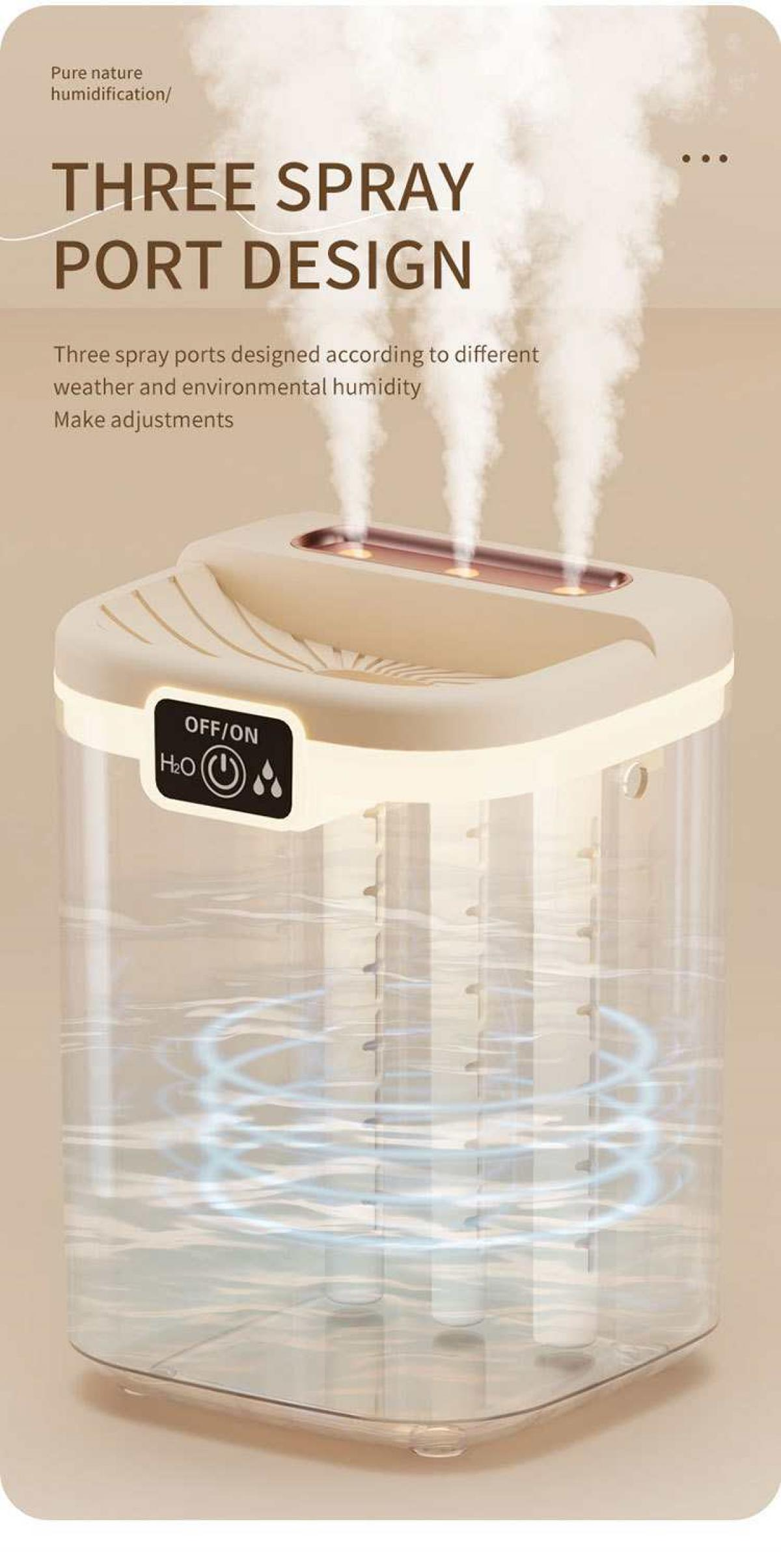 Luftbefeuchter mit drei Sprühöffnungen. Beiger Deckel, klarer Wassertank, weißer Nebel steigt auf. Ein/Aus-Taste vorhanden.