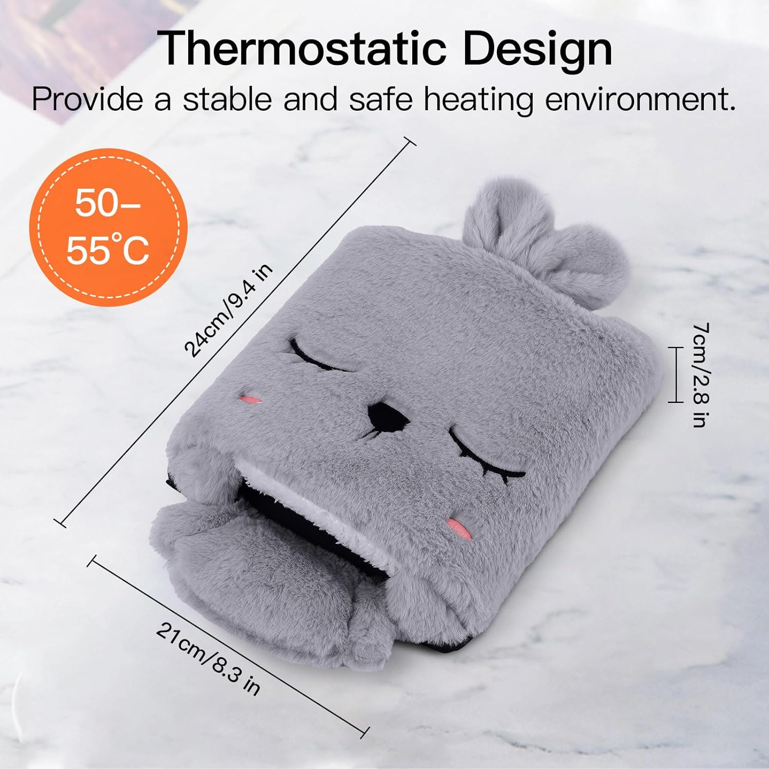 Ein grauer Plüsch-Handwärmer in Hasenform mit geschlossenen Augen. Ein orangefarbener Kreis zeigt die Temperatur 50-55°C.