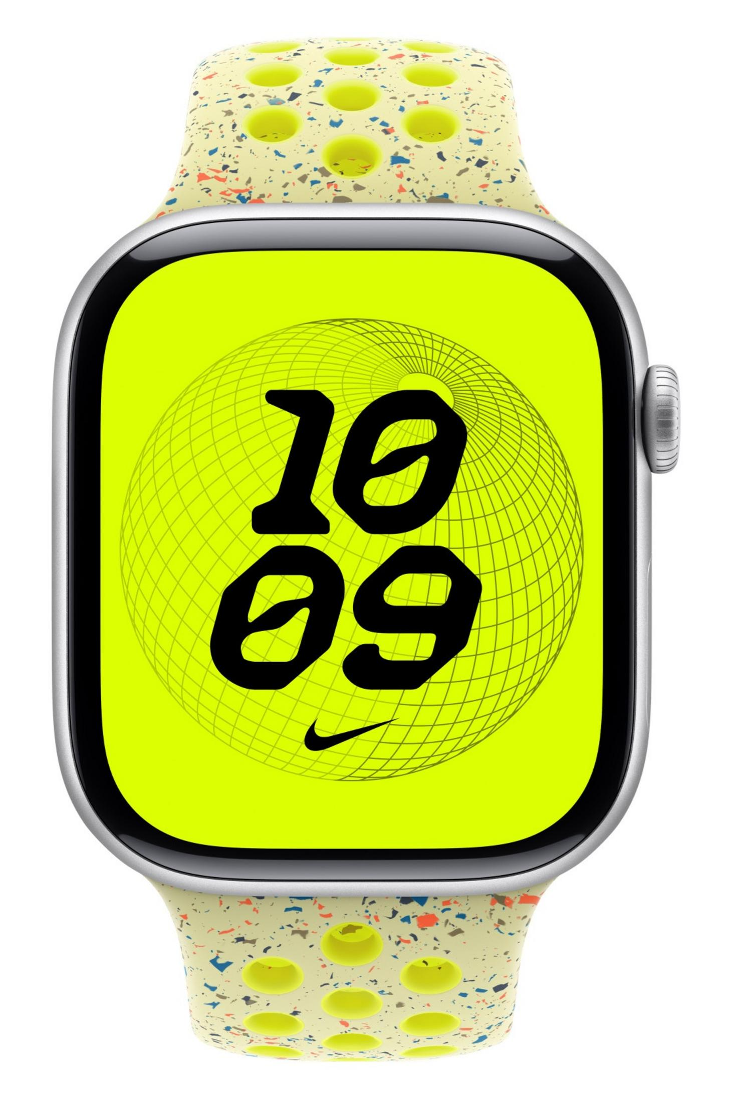 Un moderno Apple Watch con quadrante verde neon che mostra l'ora. Il cinturino è beige con macchie colorate e fori.