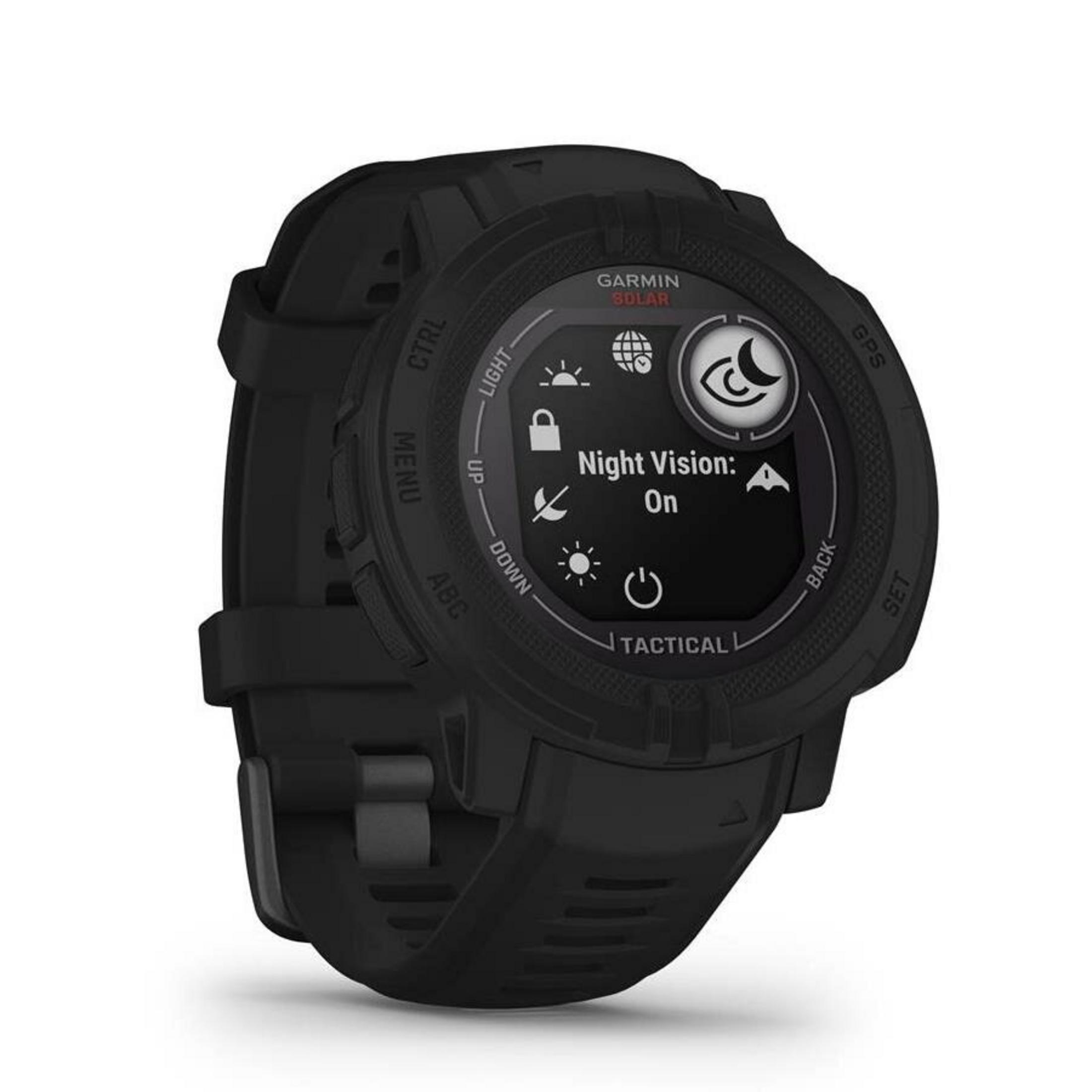 Czarny zegarek Garmin z 'Night Vision: On'. Widoczne przyciski i szczegóły ekranu. Zegarek leży na białej powierzchni.