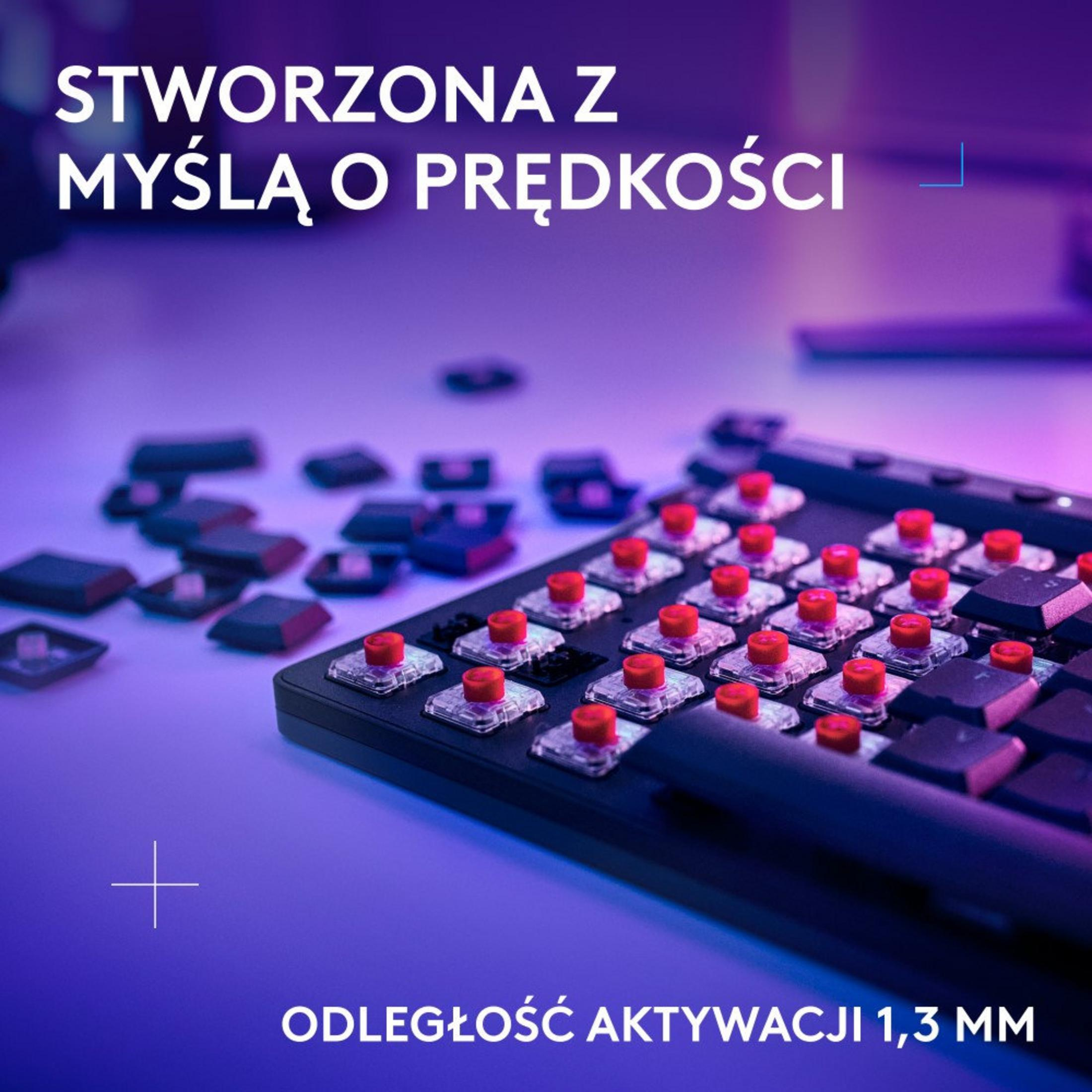 Close-up of a keyboard with red switches. Text says: Created with speed in mind. Activation distance 1.3 mm.