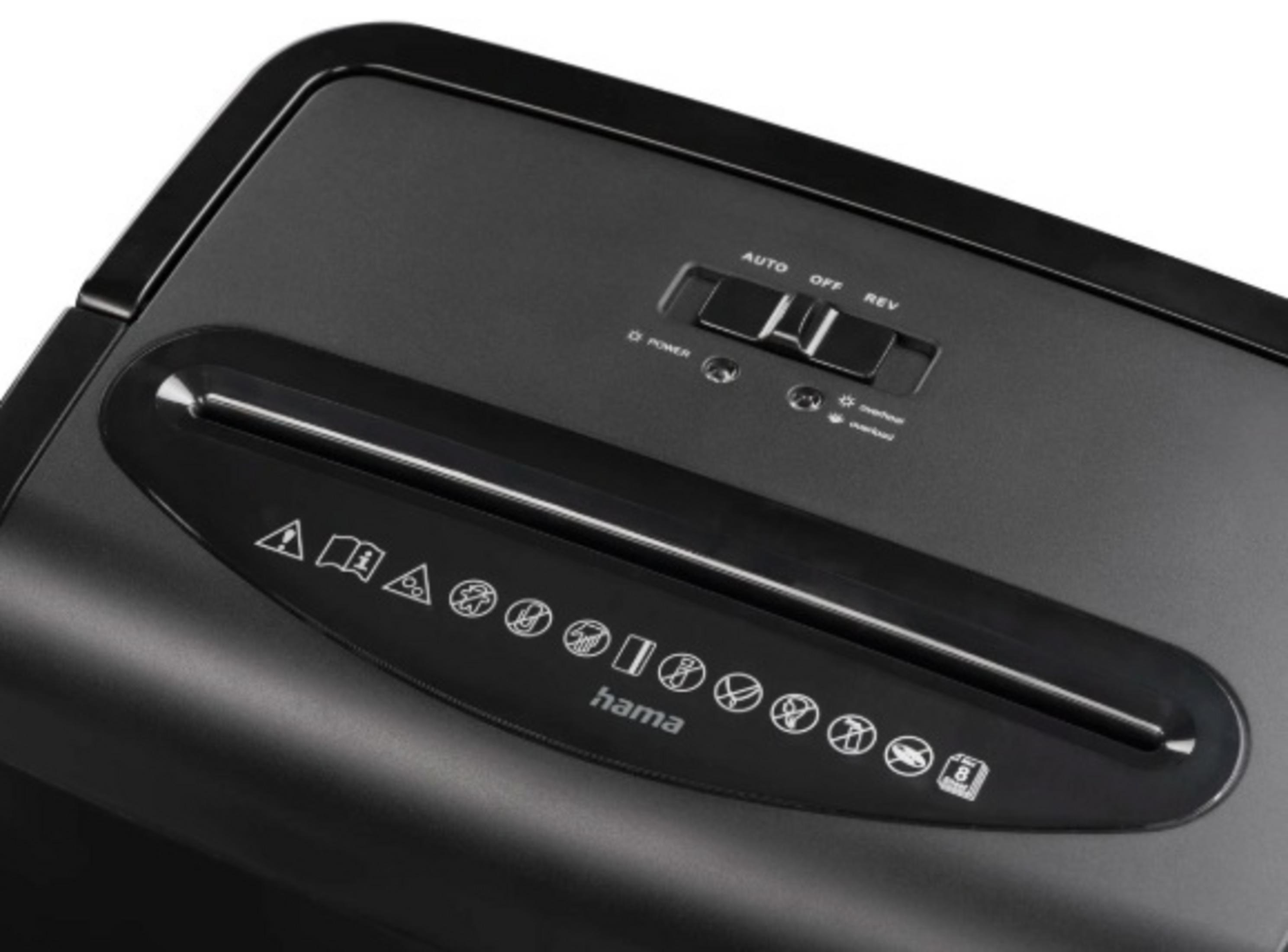 Czarna niszczarka do papieru. Posiada przełącznik auto/off/rev, szczelinę do wkładania papieru i różne ikony ostrzegawcze.