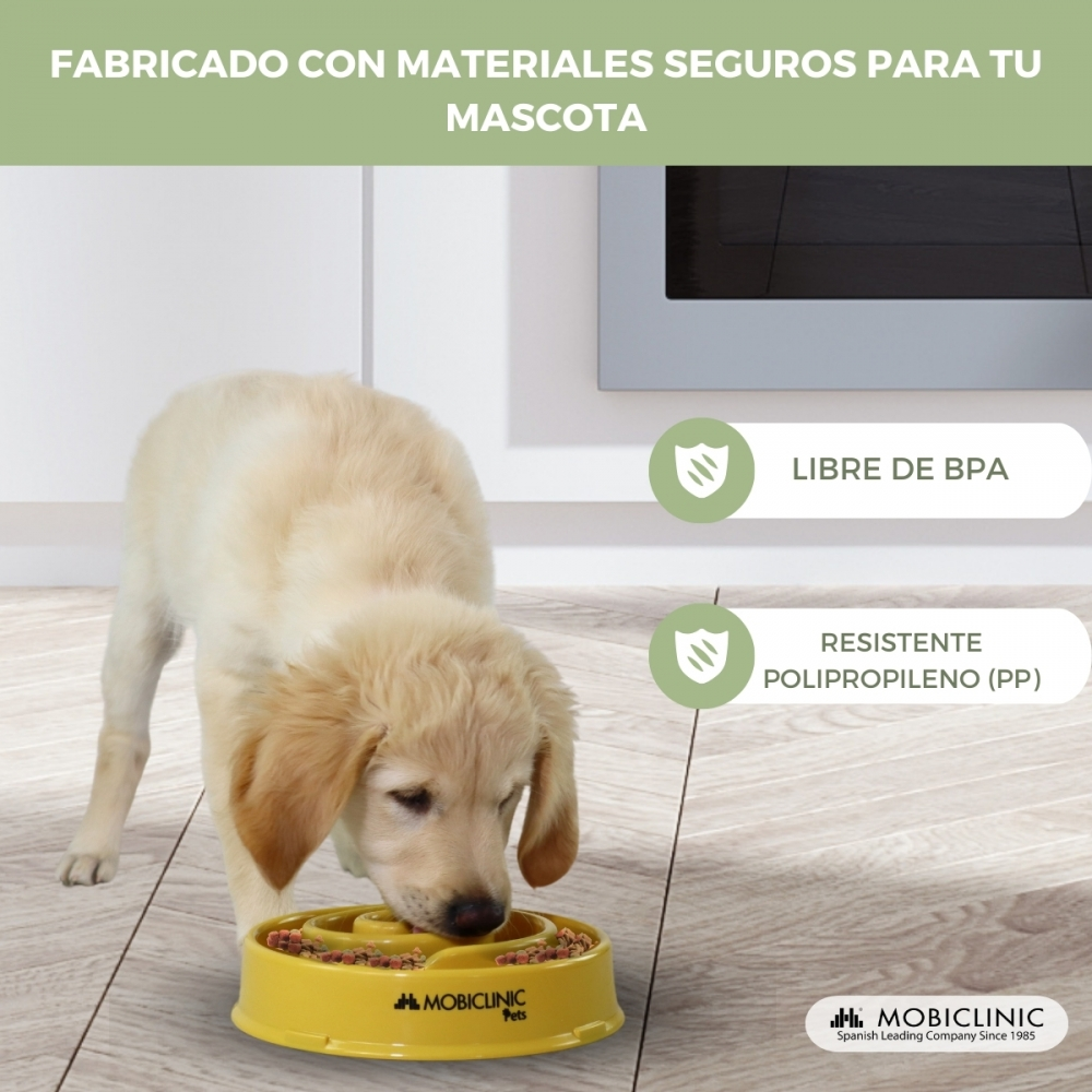Un cucciolo di golden retriever mangia da una ciotola gialla. Testo: Realizzato con materiali sicuri per il tuo animale domestico e logo Mobclinic.