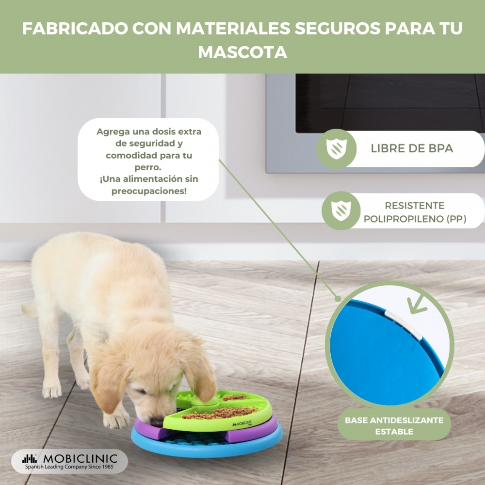 Un cachorro golden retriever come de un comedero lento colorido. El texto indica que el cuenco es seguro, sin BPA y tiene una base antideslizante.
