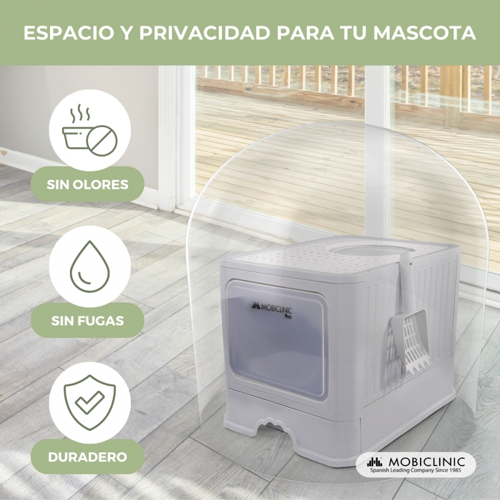 Arenero blanco para mascotas con pala, ventana transparente y ventilación. Texto: 'espacio y privacidad para tu mascota'.