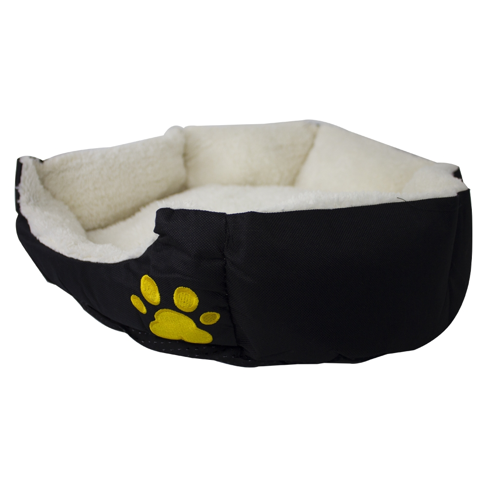 Una cama negra para mascotas con una huella de pata amarilla en el lateral. El interior es blanco y esponjoso.
