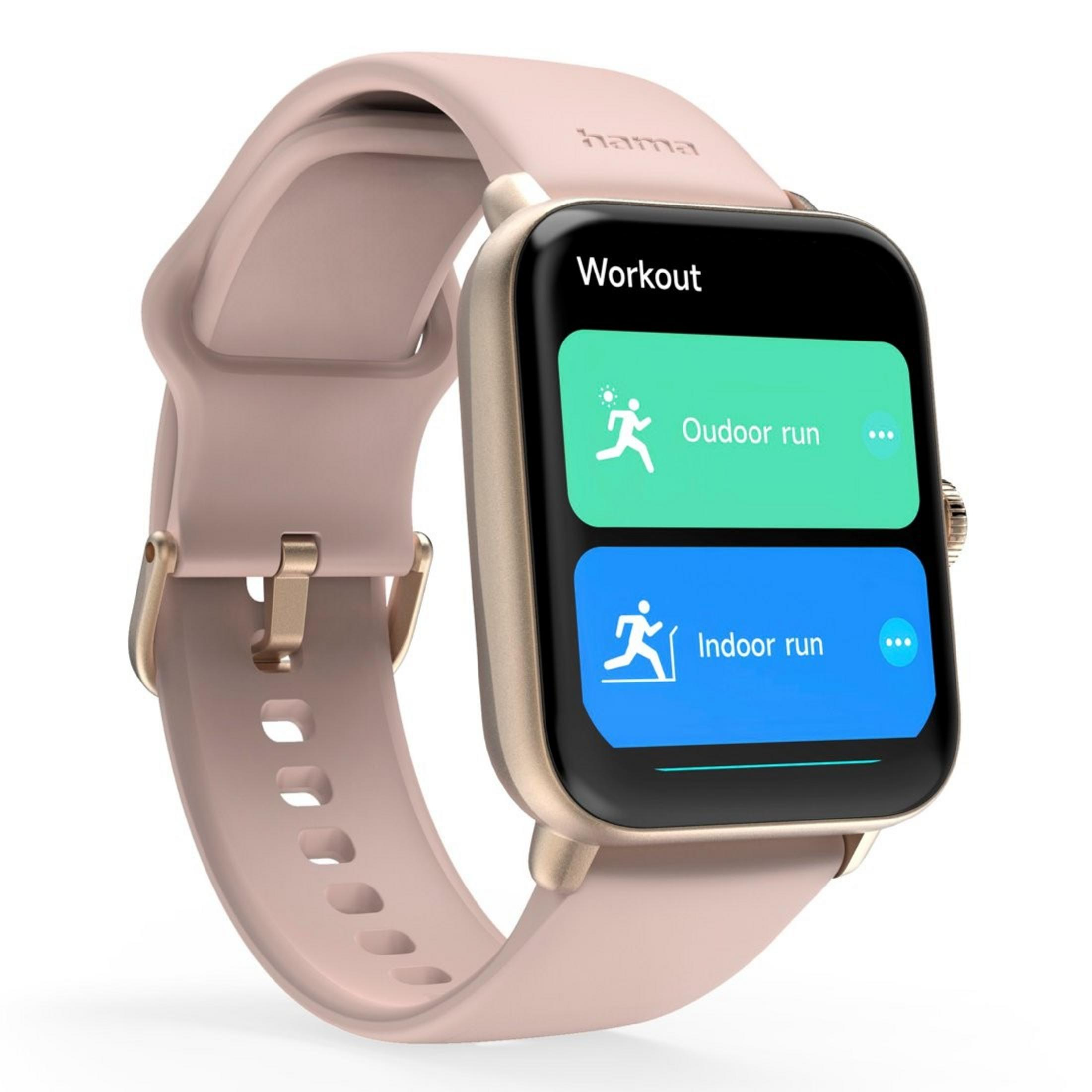 Un reloj inteligente rosa que muestra 'Entrenamiento', con opciones para correr al aire libre y en interiores. El reloj tiene una correa rosa.