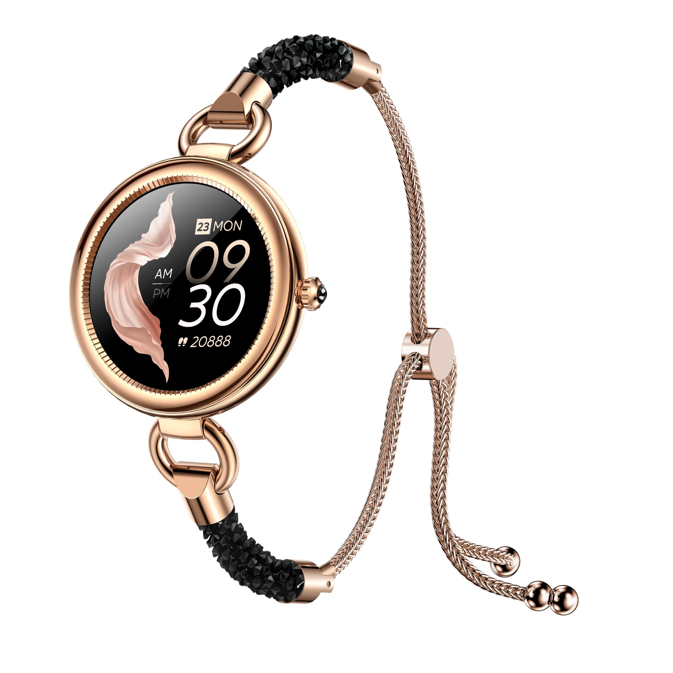 Roségoldene Smartwatch mit schwarzem Bildschirm. Das Band hat schwarze Kristalle und ein Kettenarmband.