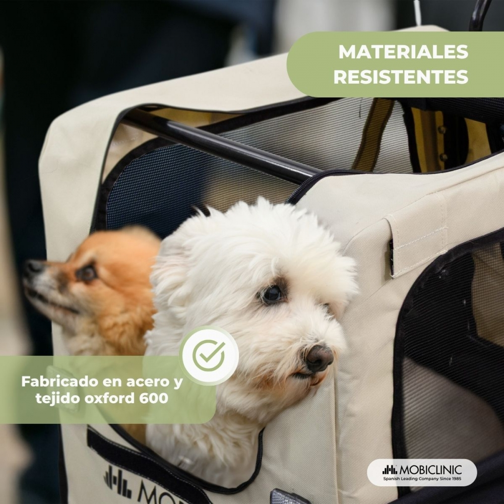 Dos perros dentro de un transportín beige. Un perro es blanco, el otro es canela. Transportín hecho de acero y tela oxford.