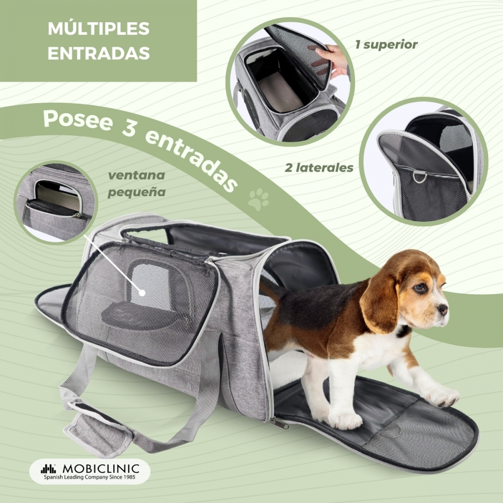 Un transportín gris para mascotas con un cachorro beagle dentro. Tiene múltiples entradas, incluidas aberturas superior y lateral.