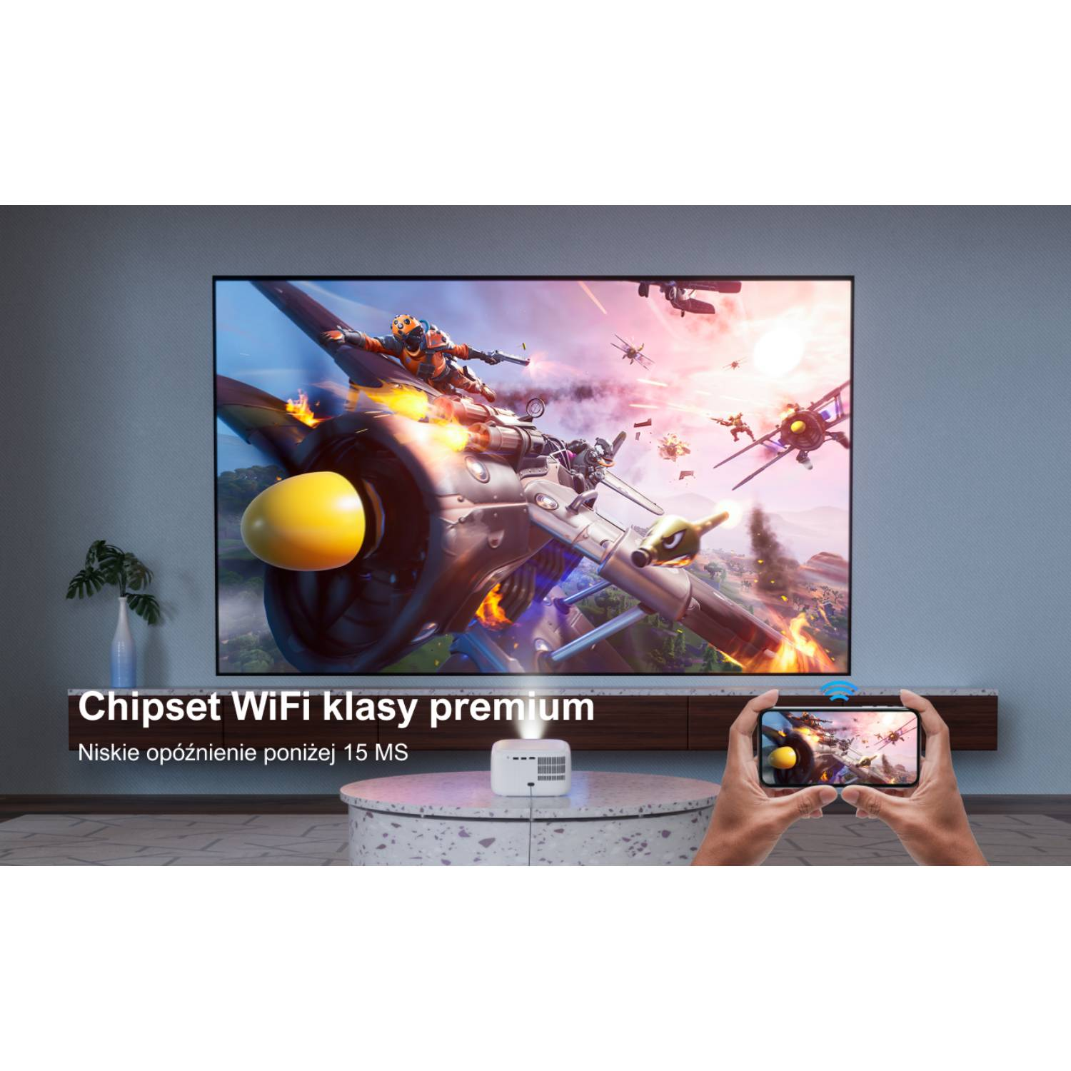 Osoba trzyma telefon z obrazem gry. Duży ekran wyświetla tę samą grę. Projektor stoi na stole.