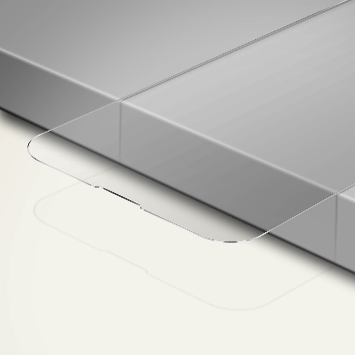 Un objet en verre clair et incurvé est placé sur une surface de couleur claire. L'objet est sur une surface rectangulaire grise.