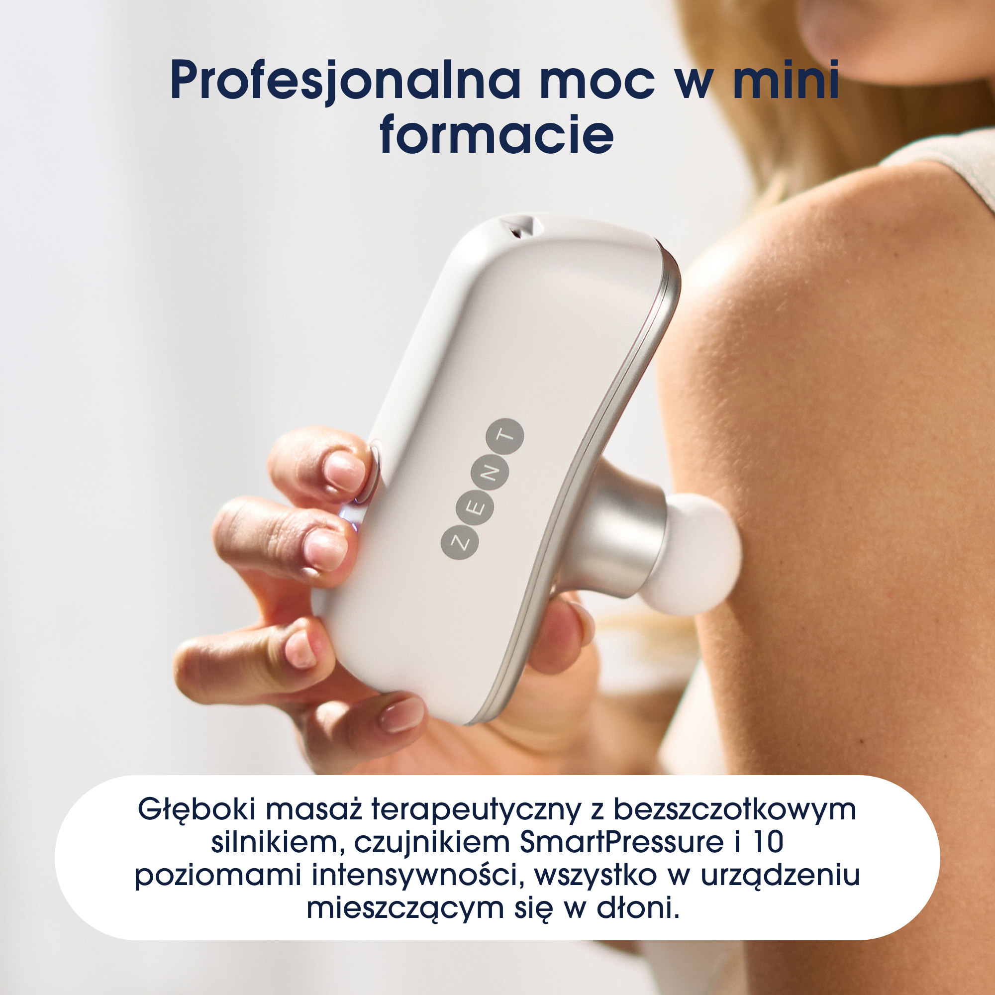 Ręka trzyma białe urządzenie do masażu przy ramieniu. Tekst: profesjonalna moc w mini formacie.