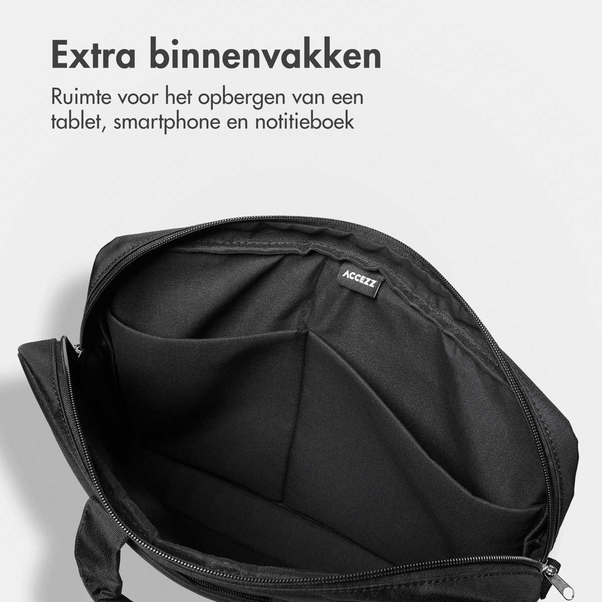 Open zwarte laptoptas met meerdere compartimenten. Boven staat: 'Extra binnenvakken'. De tas is leeg.
