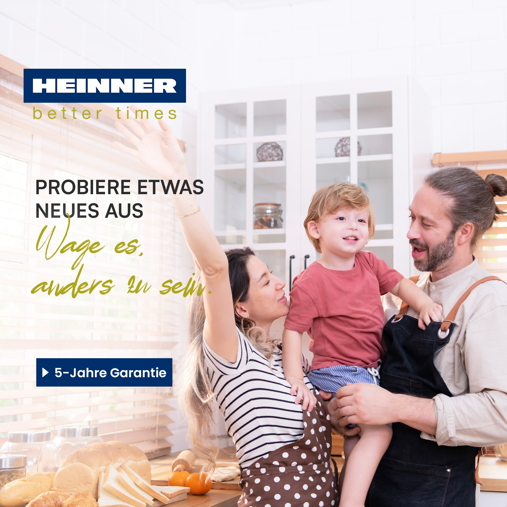 Family in kitchen. Mom waves, dad holds child. Breads, oranges on table. Text: Try something new, be different.