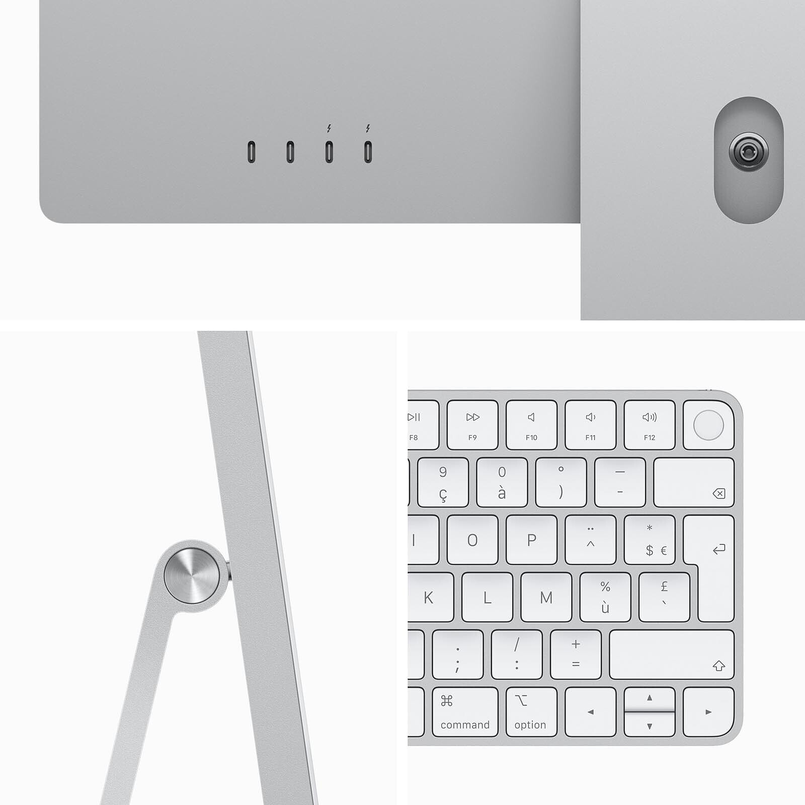 Un primo piano di un computer argentato, tastiera e porte. La tastiera è in primo piano, con lo schermo e le porte sullo sfondo.