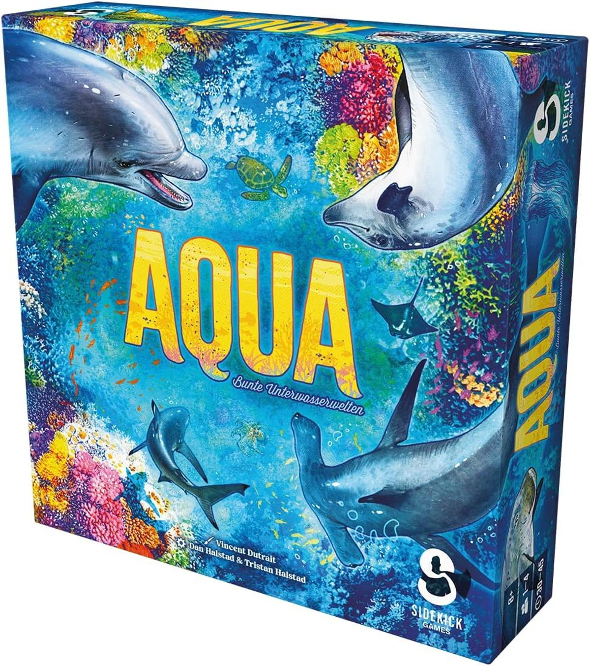 Die Spielbox zeigt eine Unterwasserszene mit Delfinen, einem Mantarochen und anderen Meeresbewohnern. Der Titel "AQUA" steht in großen gelben Buchstaben.
