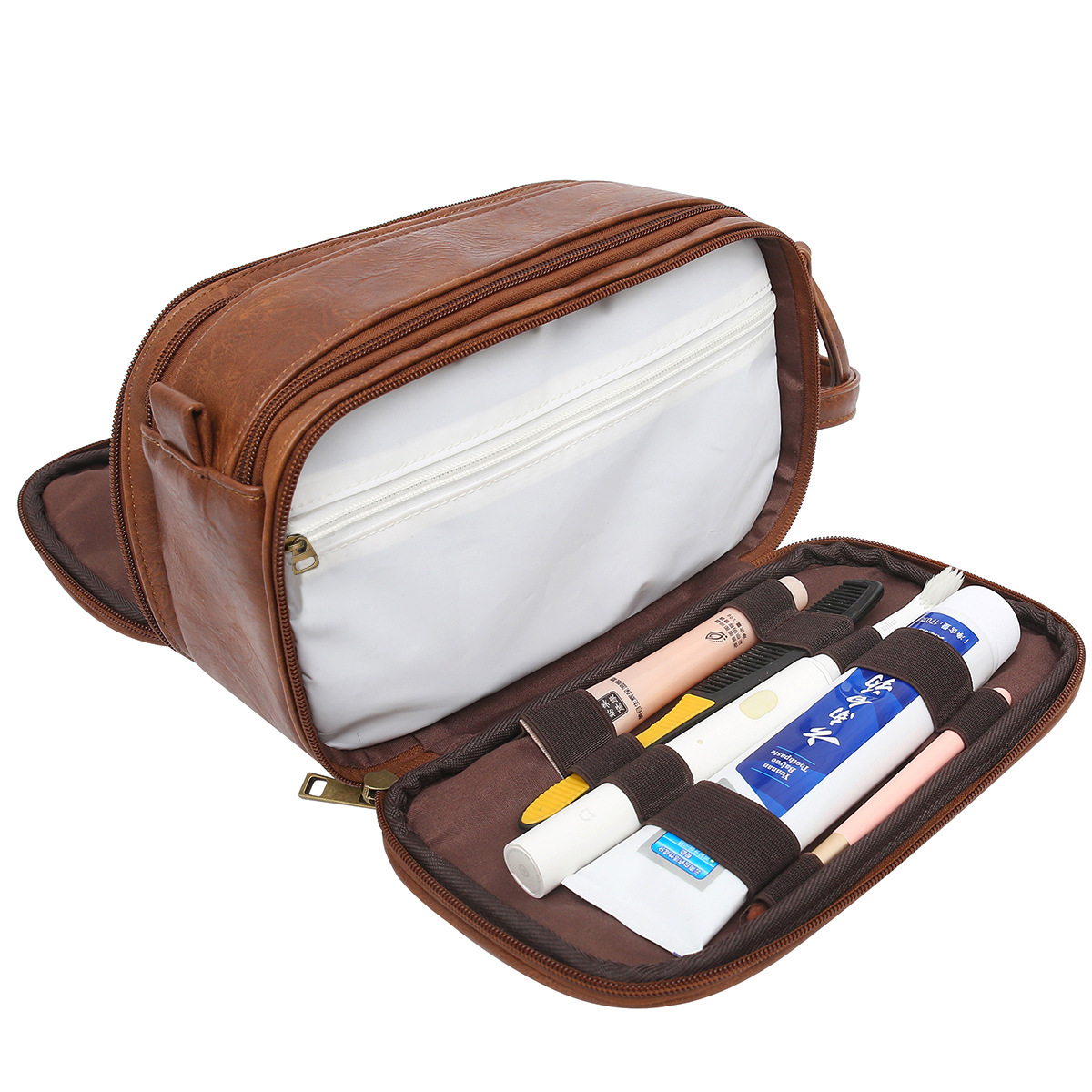 Eine braune Kulturtasche mit geöffnetem Fach, das Zahnbürsten und Tuben enthält.