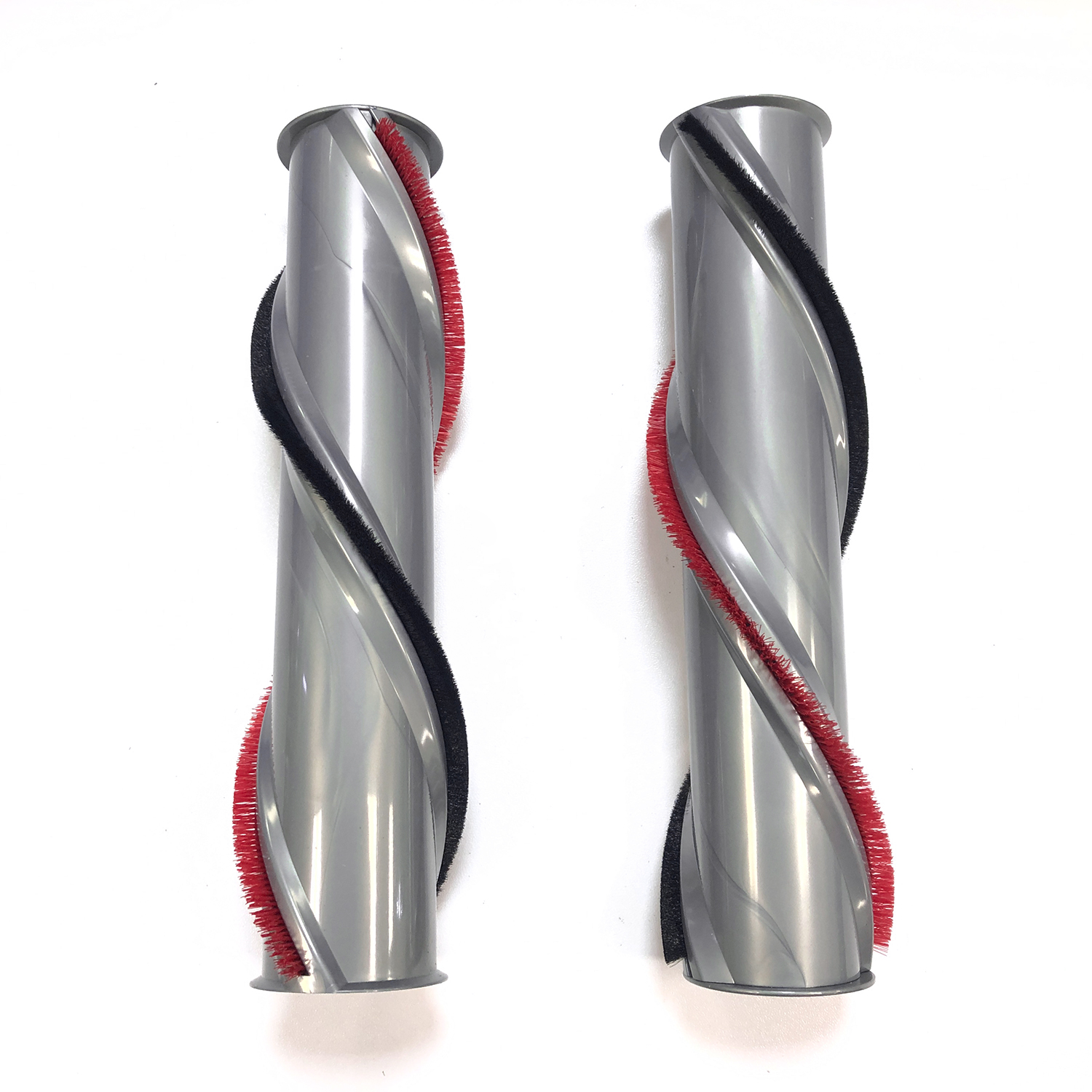 Dwa szare wałki szczotki odkurzacza z czerwonymi i czarnymi włosiami na białym tle.