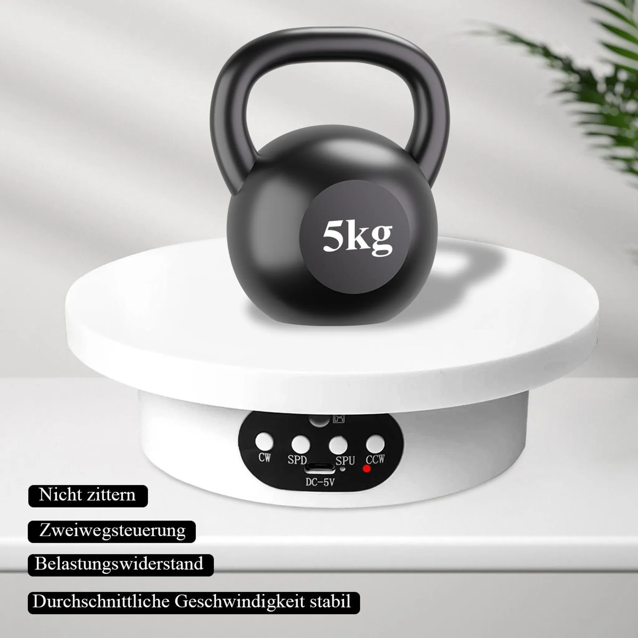 Ein 5 kg schweres Kettlebell ruht auf einer weißen drehenden Plattform mit Bedienelementen.