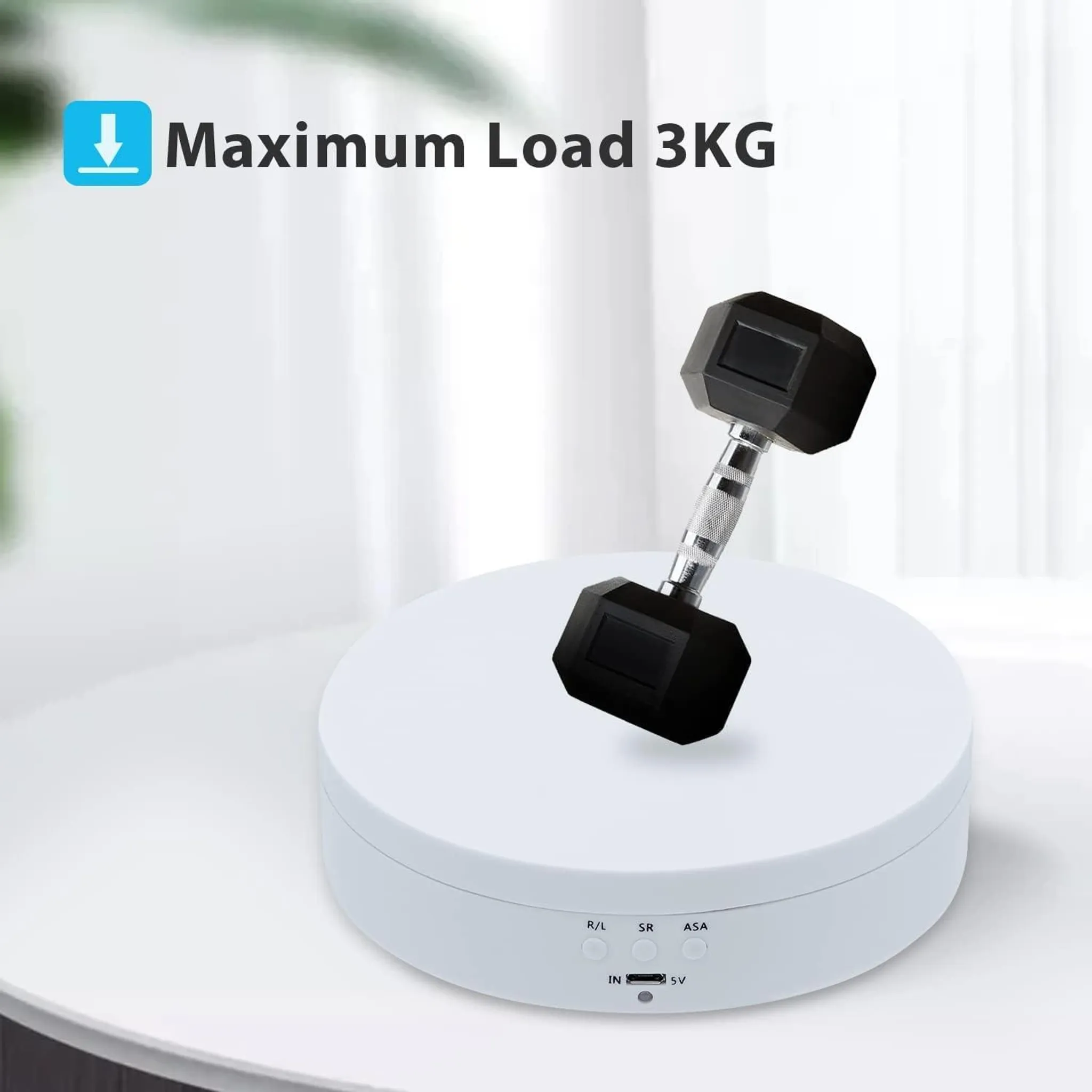 Eine schwarze Hantel ruht auf einem weißen Drehteller mit der Aufschrift 'Maximum Load 3KG'.