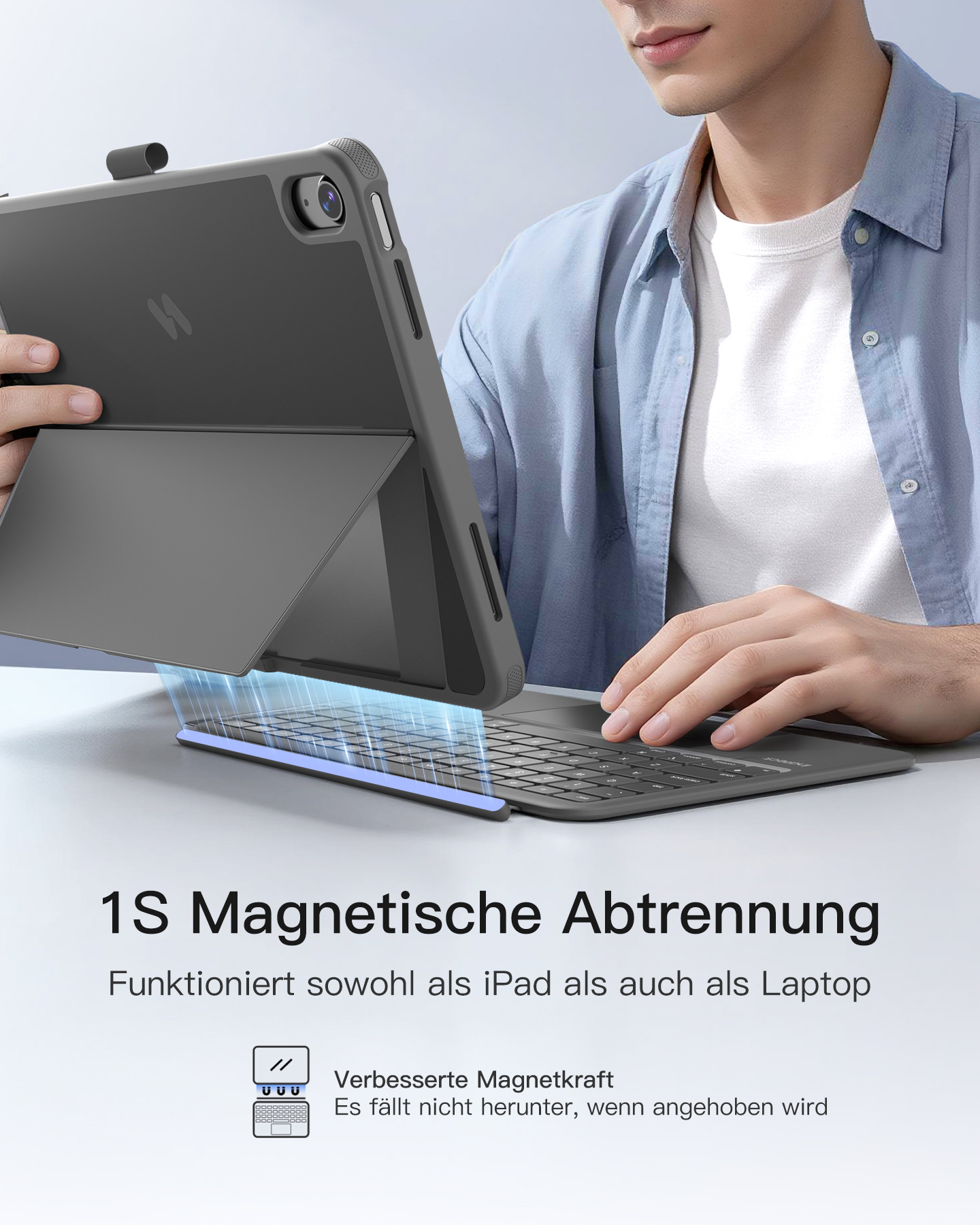 Graues iPad mit Tastatur-Case, von Mann gehalten. Magnetische Abtrennung.