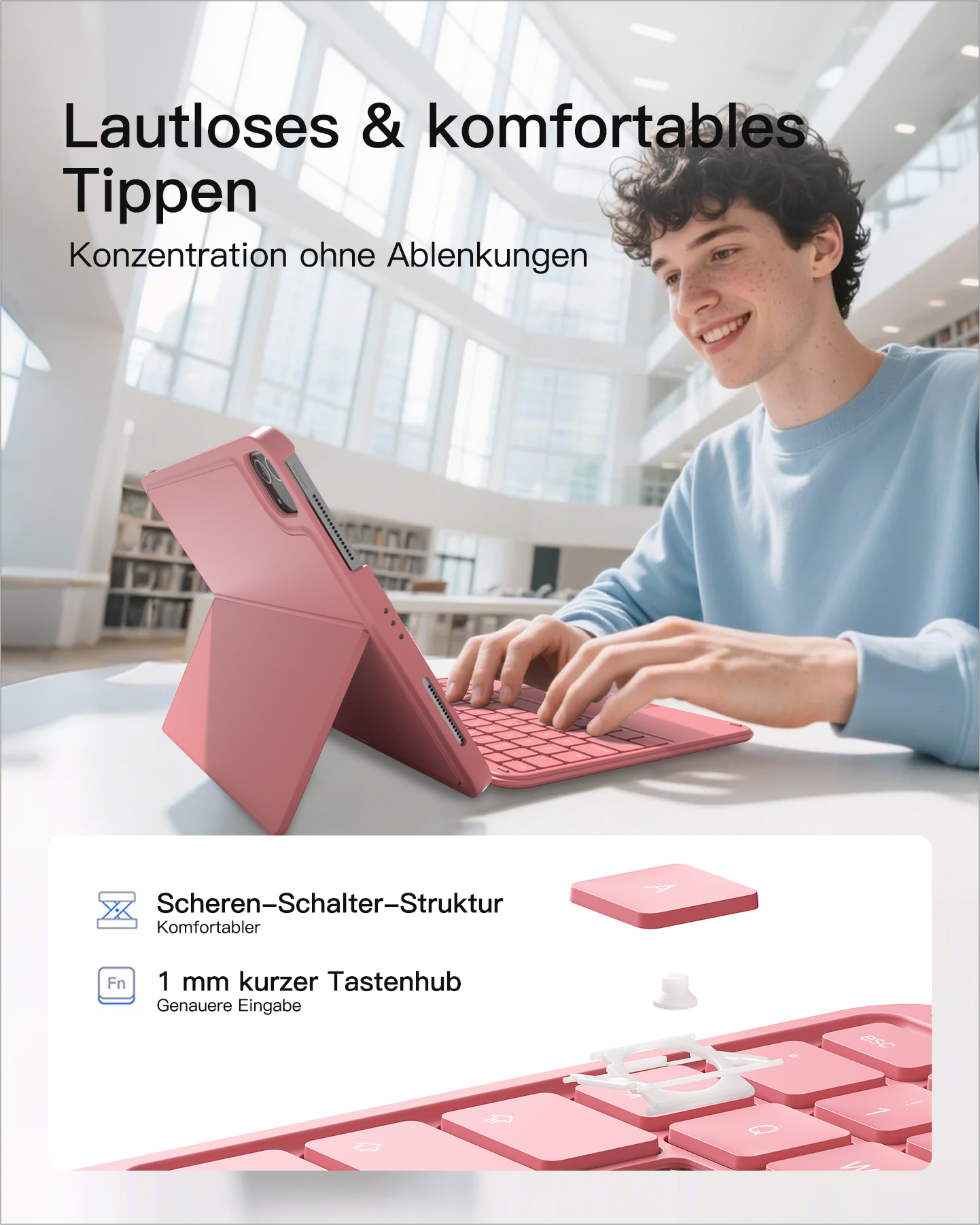 Junger Mann benutzt ein pinkes Tablet mit Tastatur in heller, moderner Umgebung.