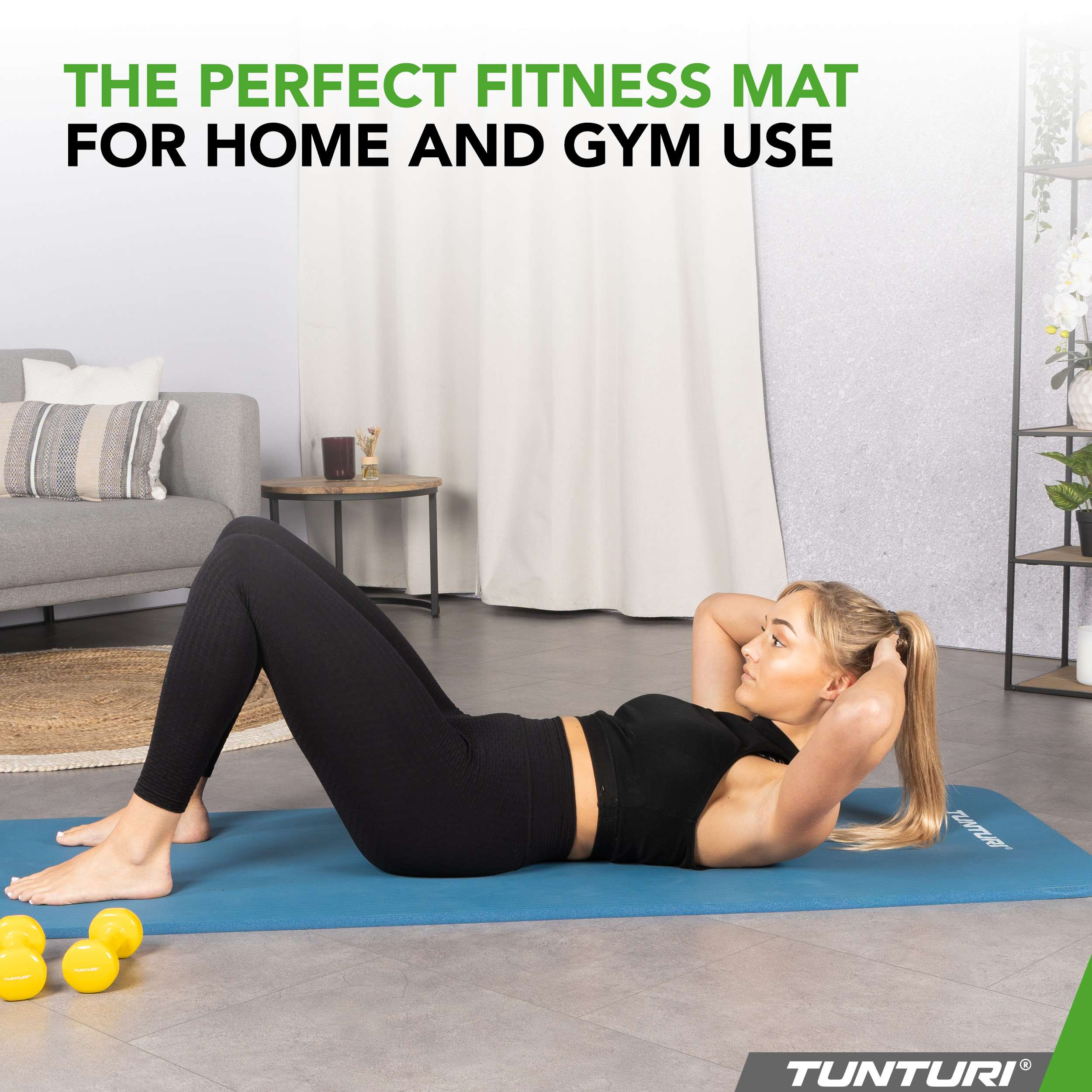 Woman doing crunches on a blue fitness mat with yellow dumbbells nearby.