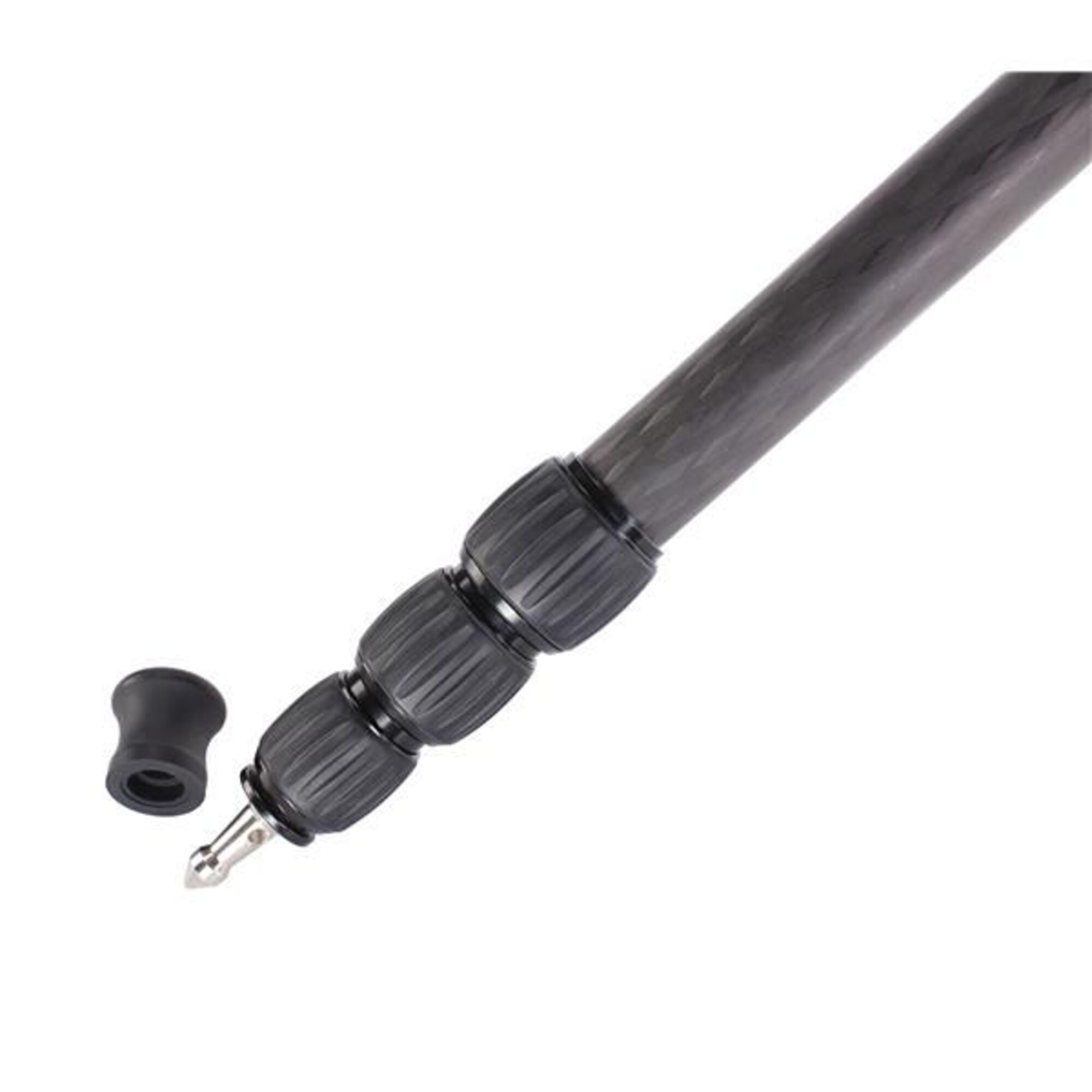 A carbon fiber tripod leg with black twist locks and a detached rubber foot.