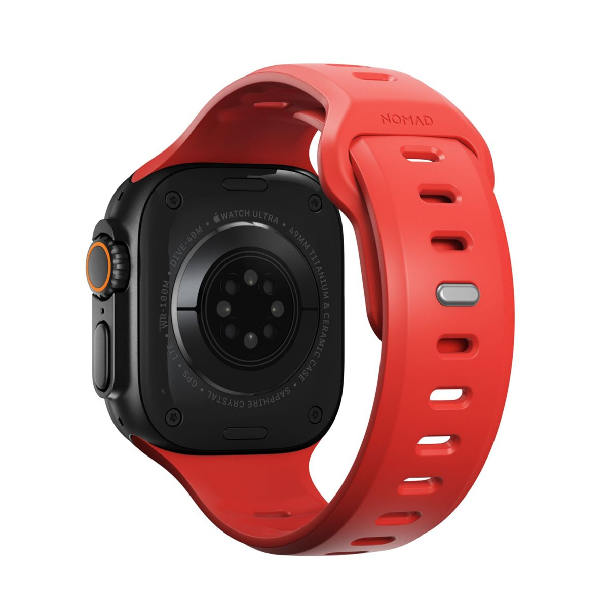 Una correa roja Nomad está unida a un Apple Watch Ultra negro, mostrando su parte trasera.